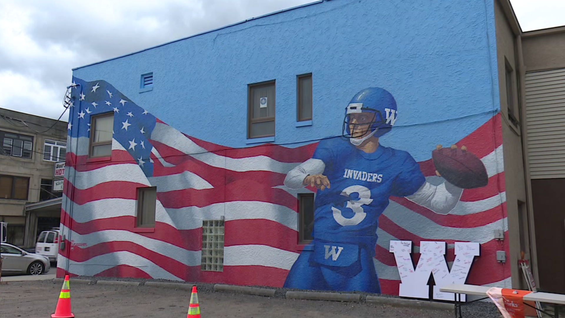 Local football player featured larger than life.