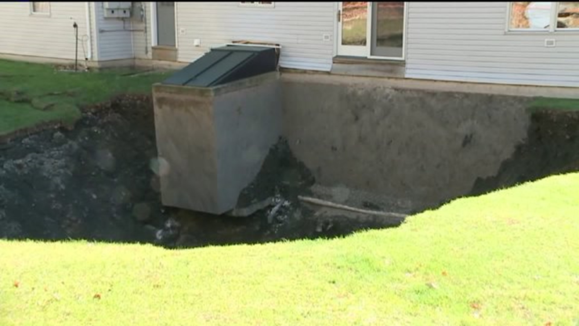 Family Fears Backyard Hole Could Swallow Home