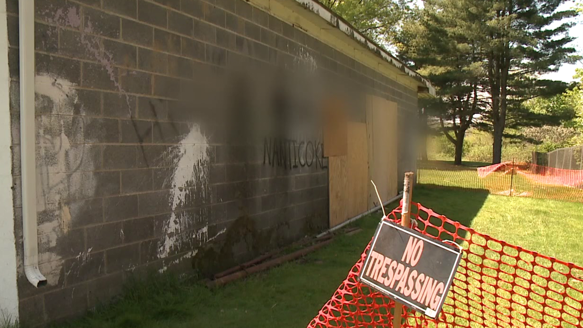 A wall was destroyed and then spray painted by vandals at Quality Hill Park.