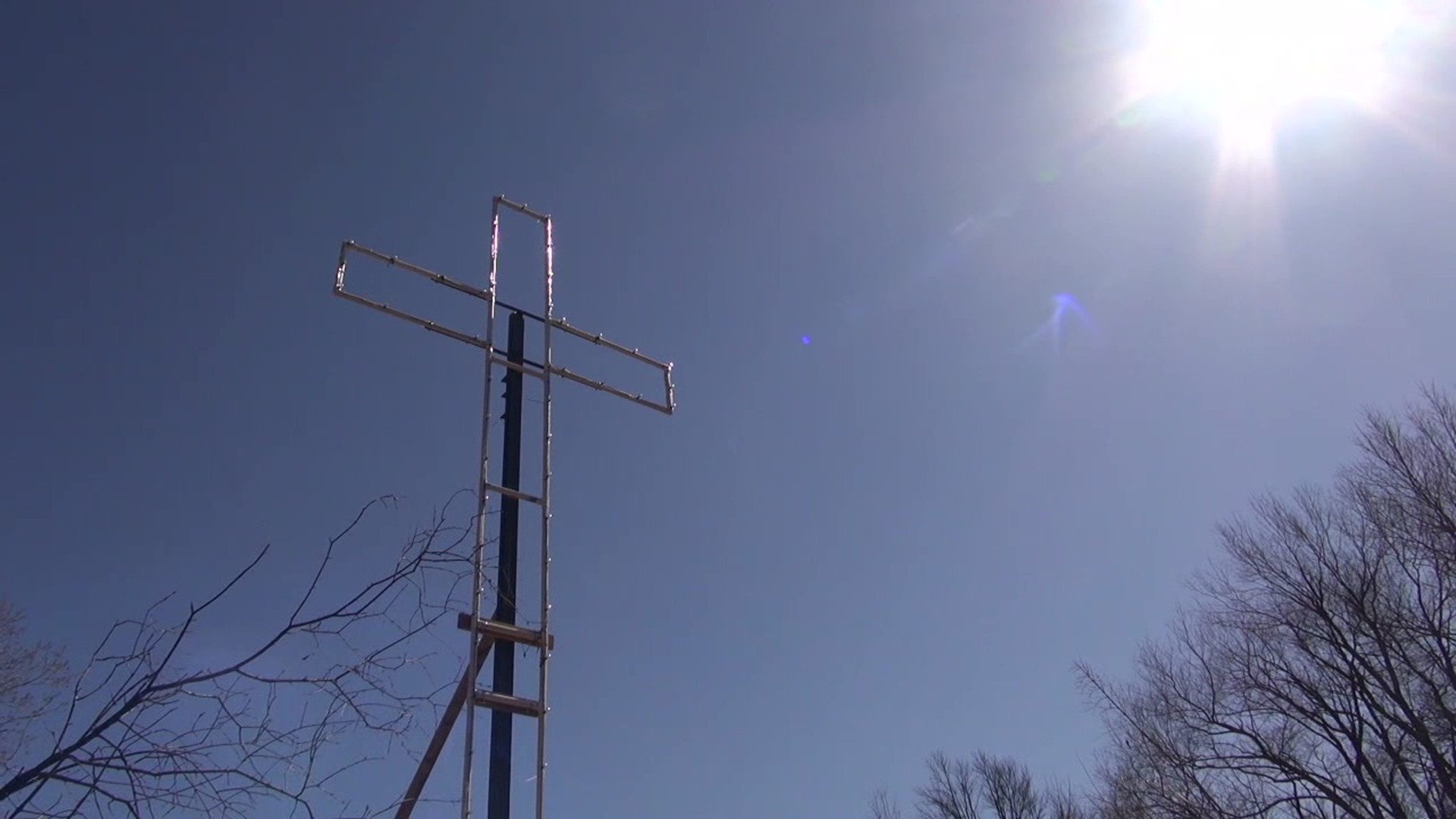 A lighted cross that disappeared from the town in Wayne County three years ago has reappeared in a different location.