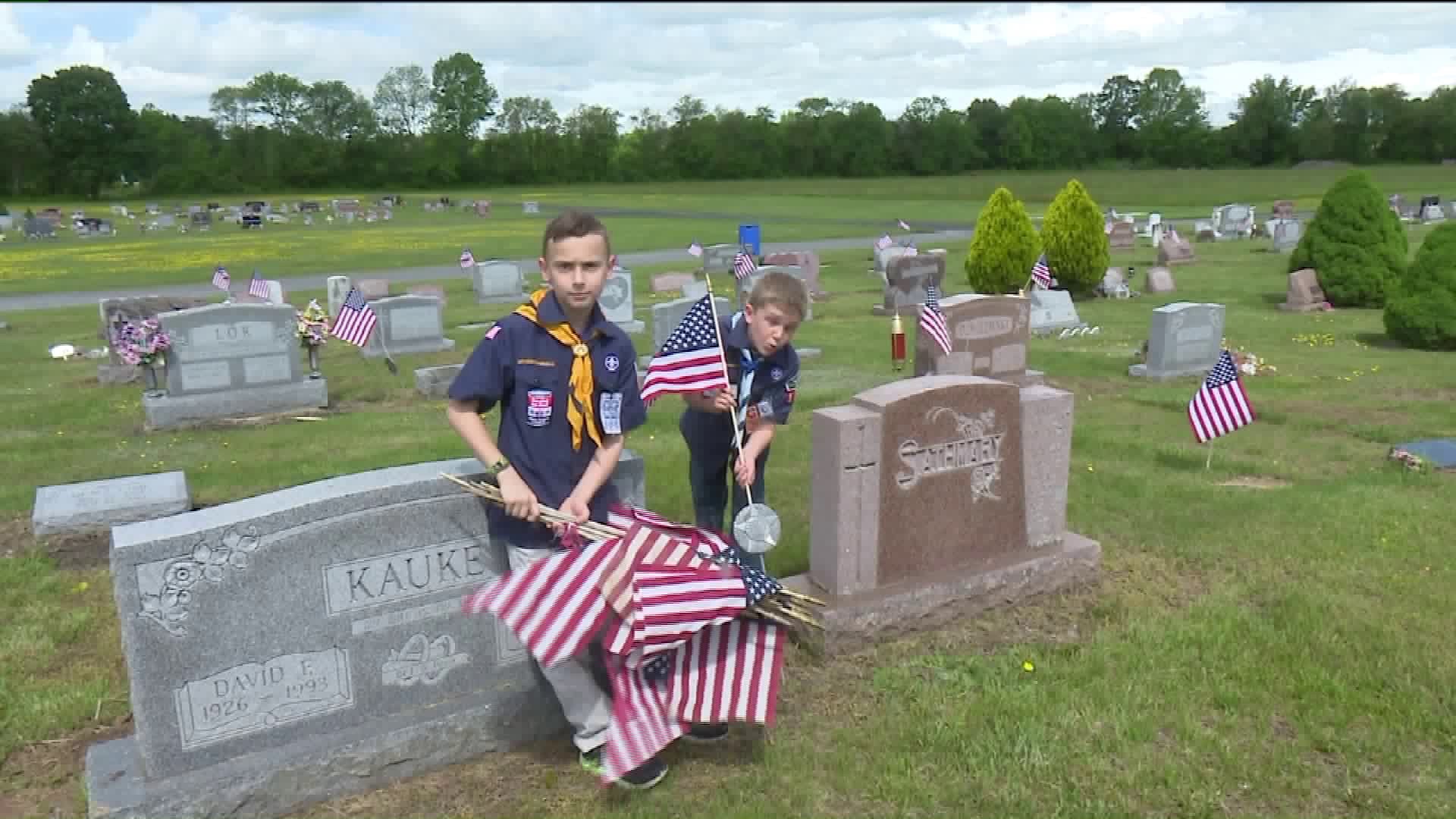 Cub Scouts Place American Flags at Cemetery in Monroe County