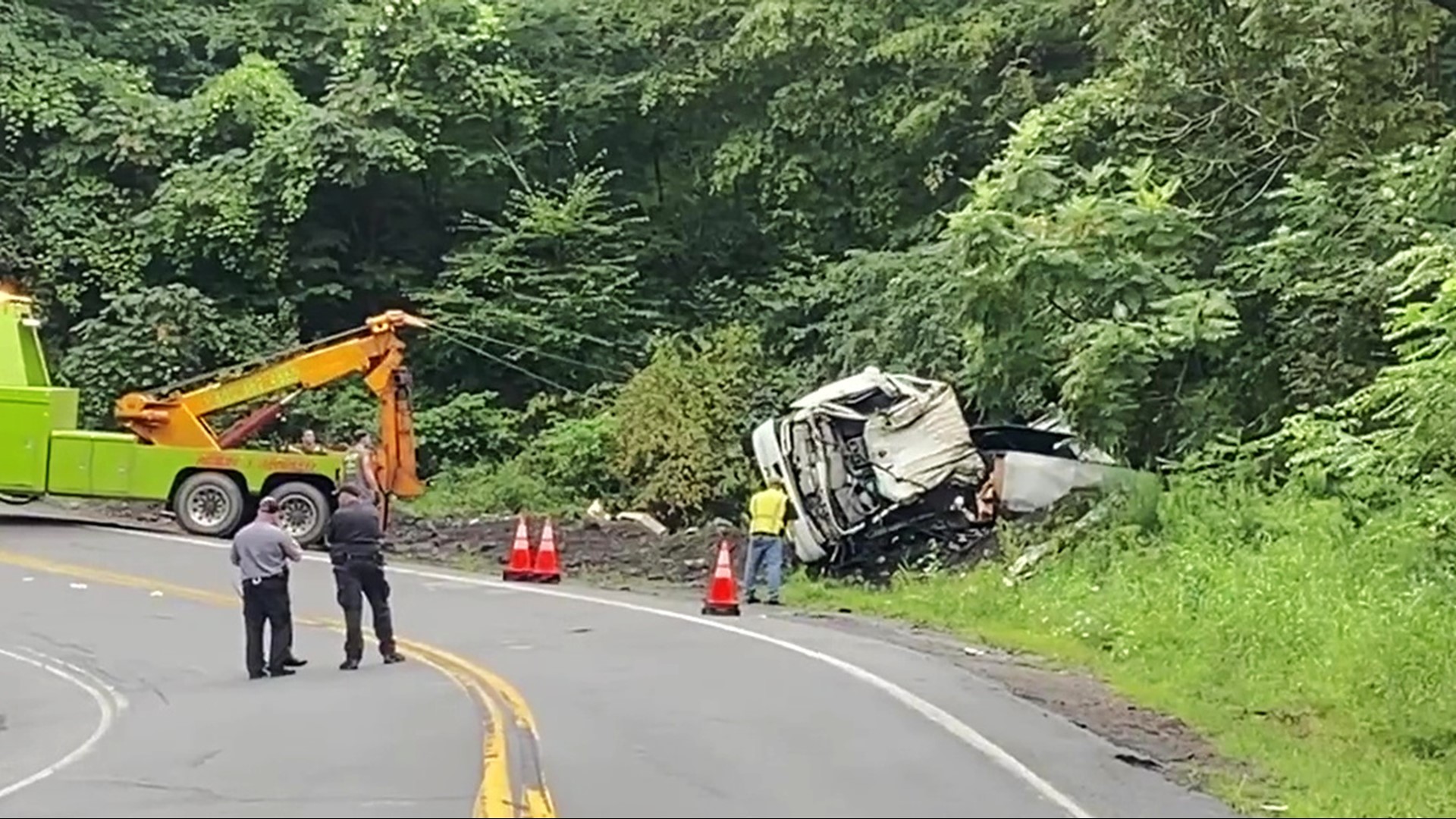 The truck apparently lost control on a curve and went off the road Monday morning.