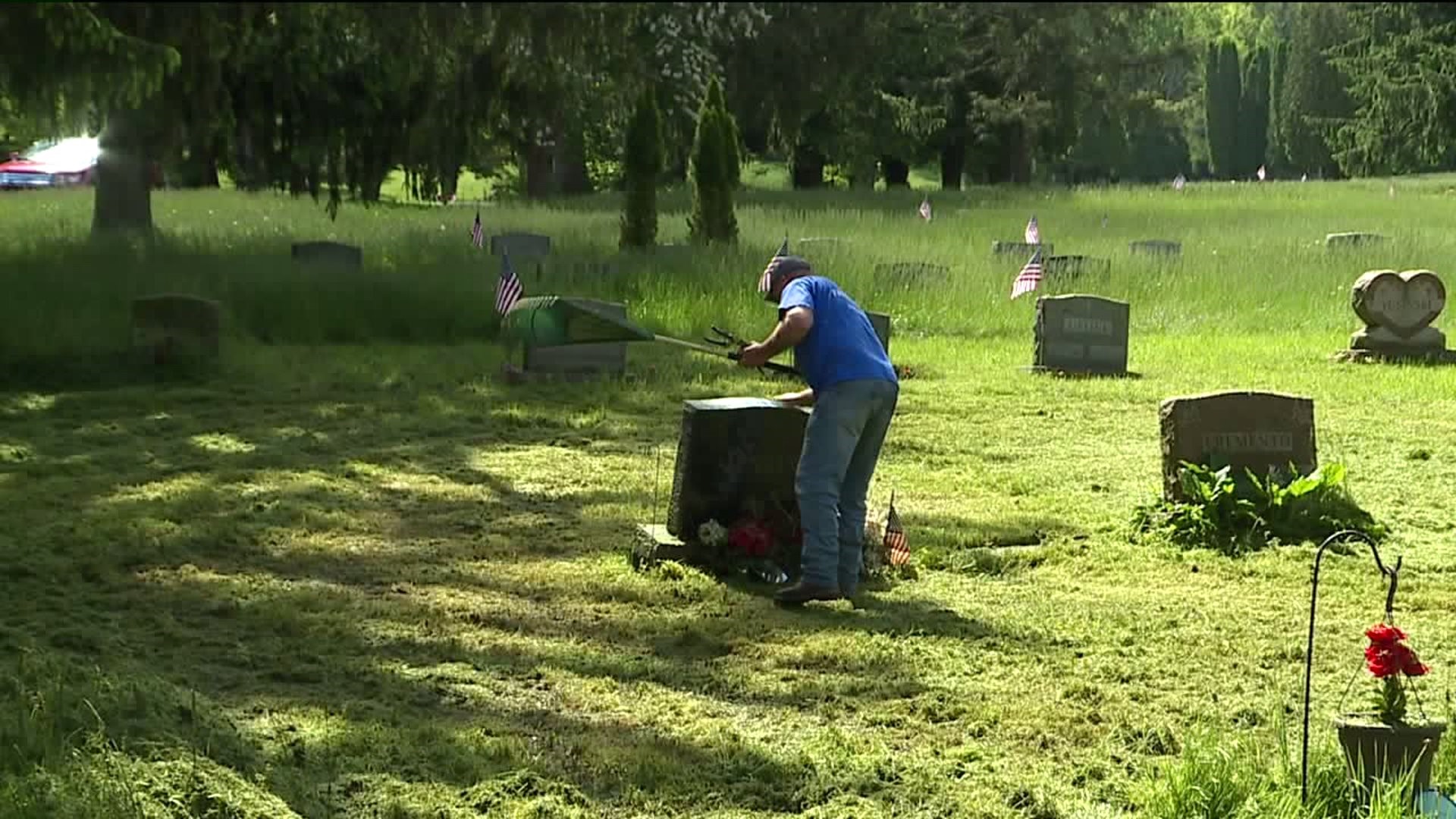 Family Members Take Matters into Own Hands at Overgrown Cemetery