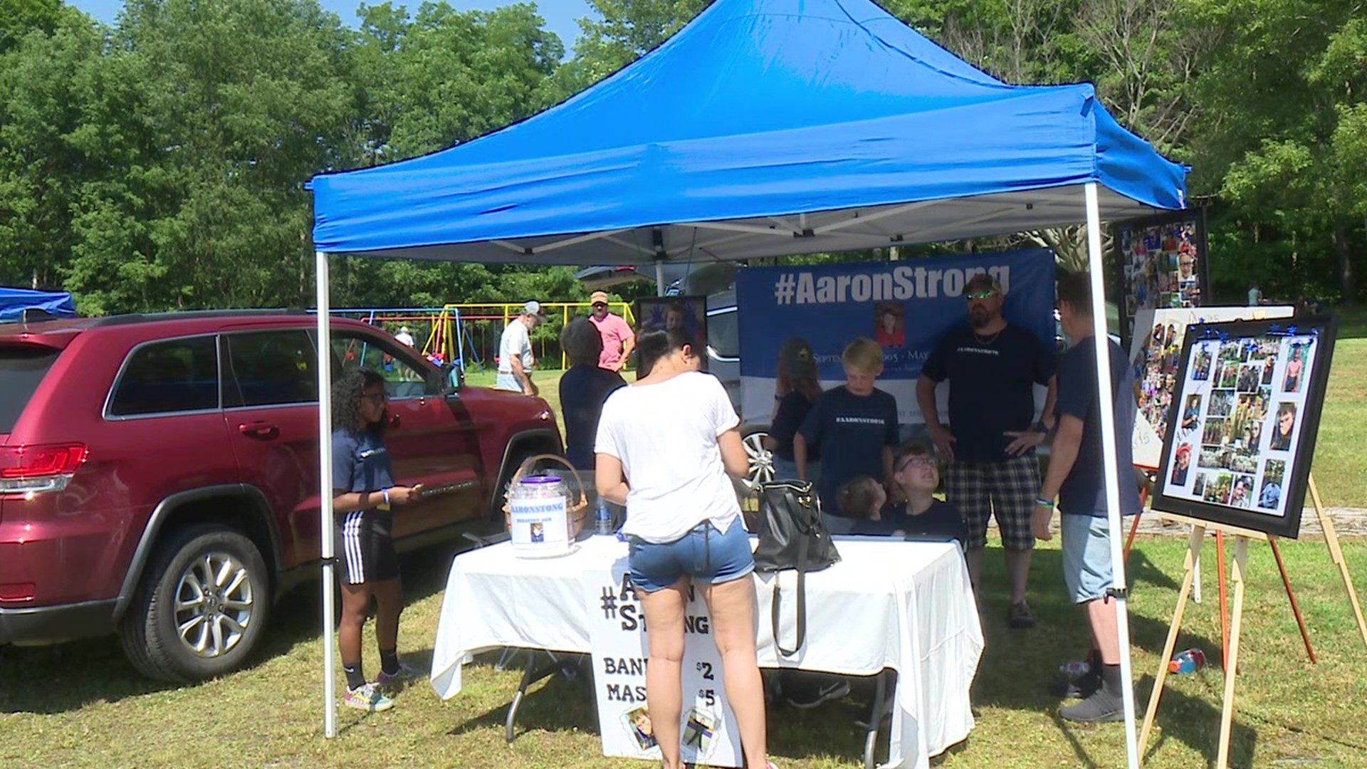 Aaron Winans' family is honoring his memory by selling bracelets and face masks at a vendor market in Kennedy Park.