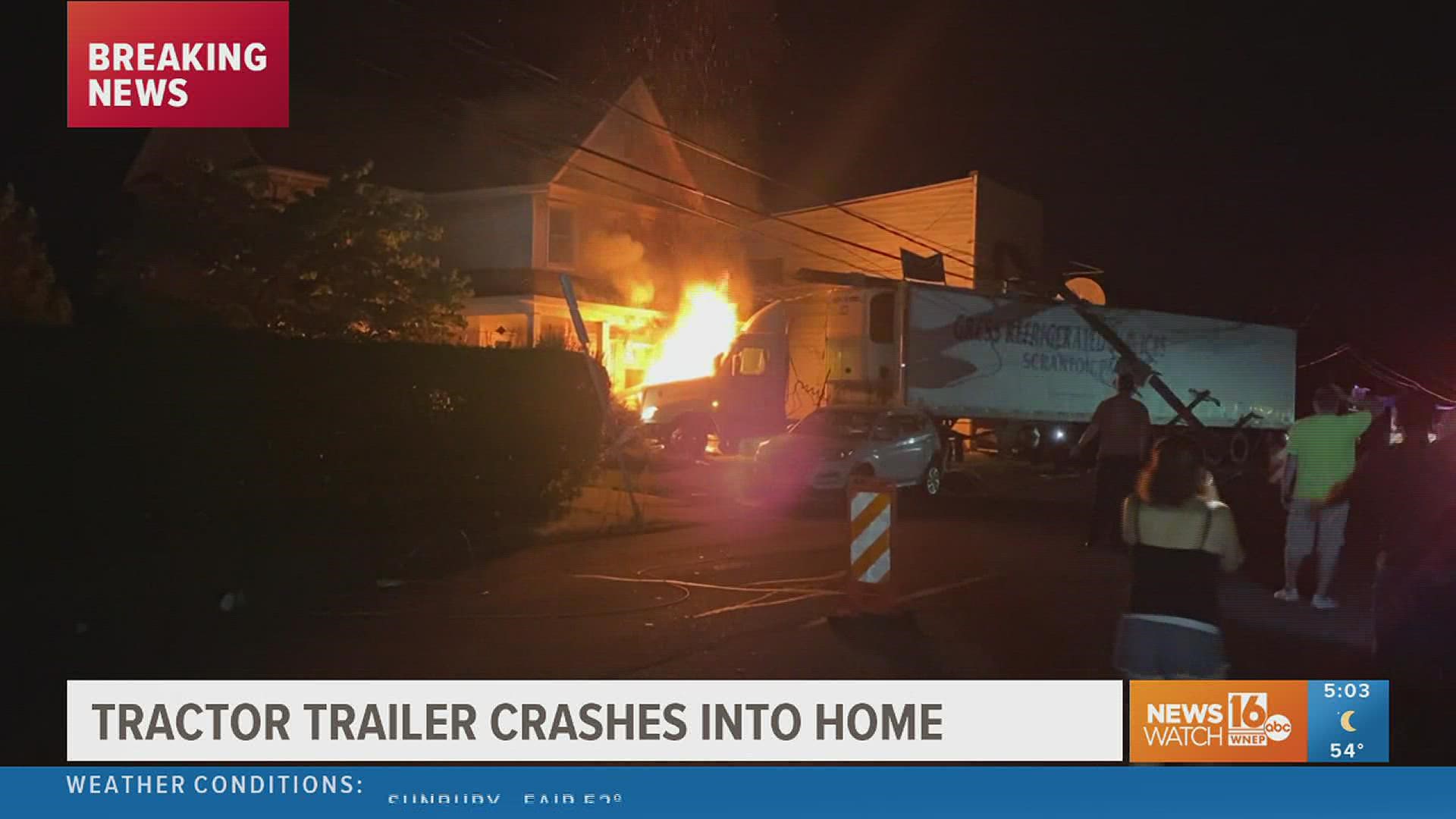 Two people were in the home at the time of the crash. They are ok. The driver of the tractor-trailer was taken to the hospital. There is no word on his injuries.