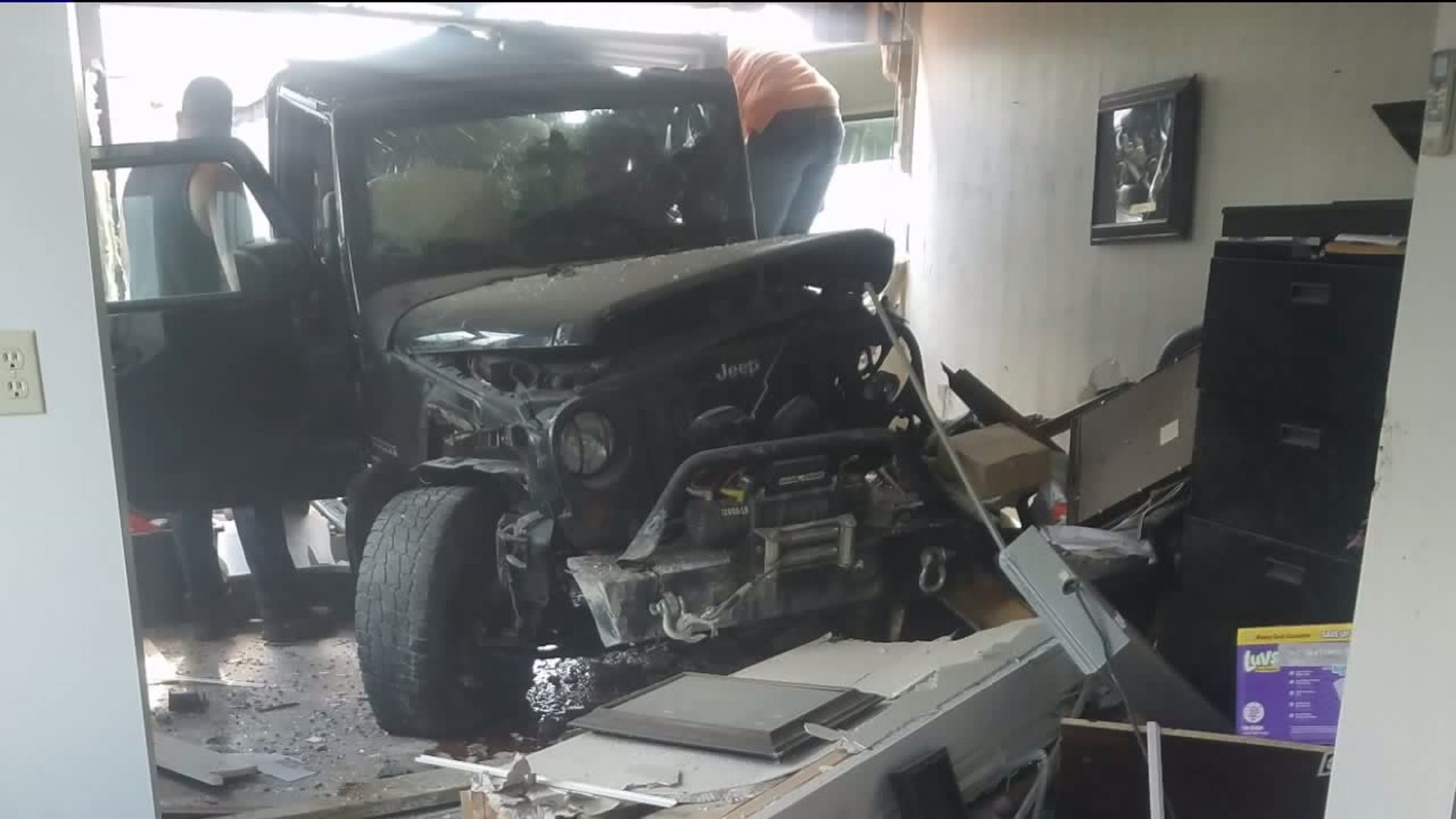 Worker Talks About Near Miss with Disaster After Jeep Crashes into Auto Shop