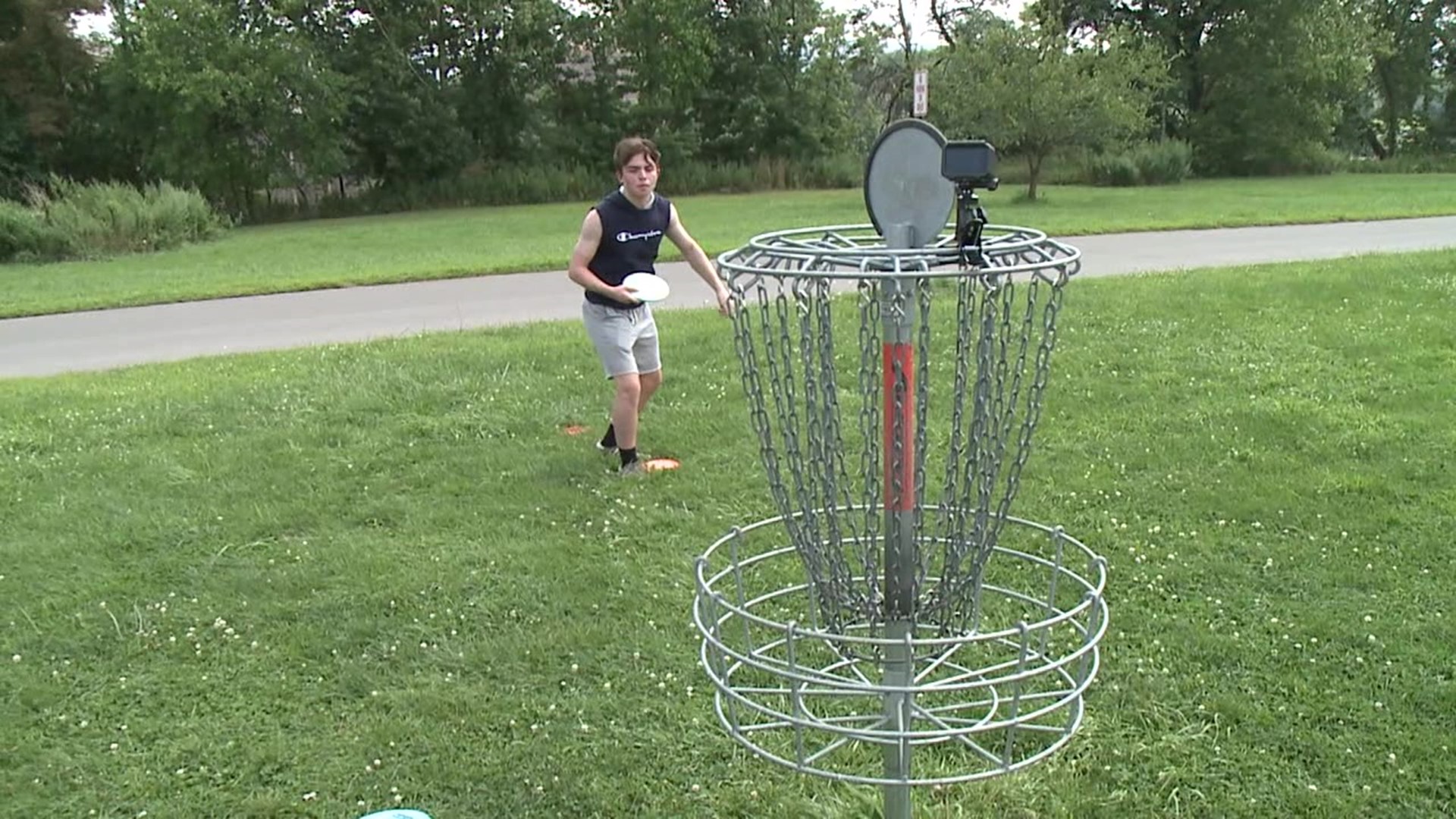 One family took to the disc golf course at Nesbitt Park despite the high temperatures and humidity.