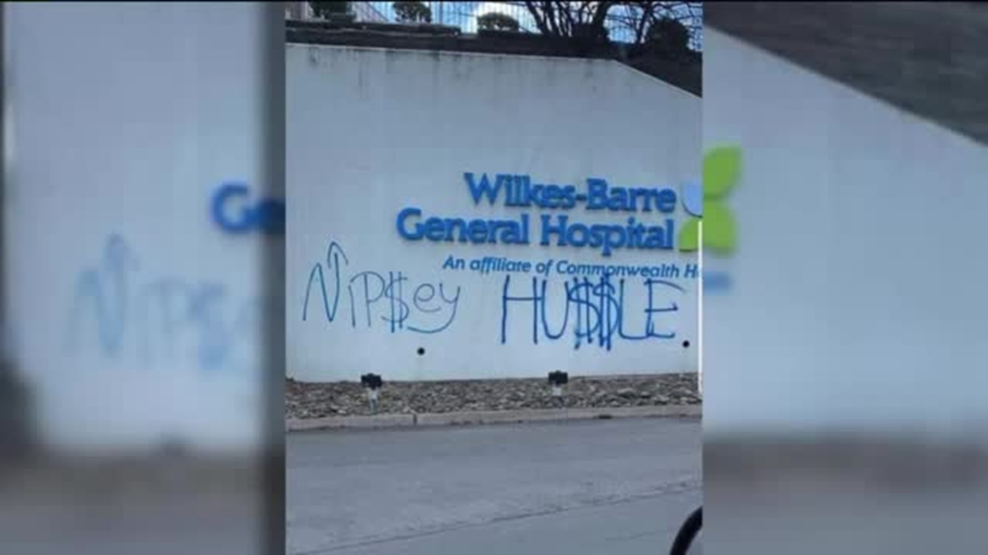 Vandals Wanted After Spray-painting Hospital Sign, Buses with Name of Murdered Rapper and Activist