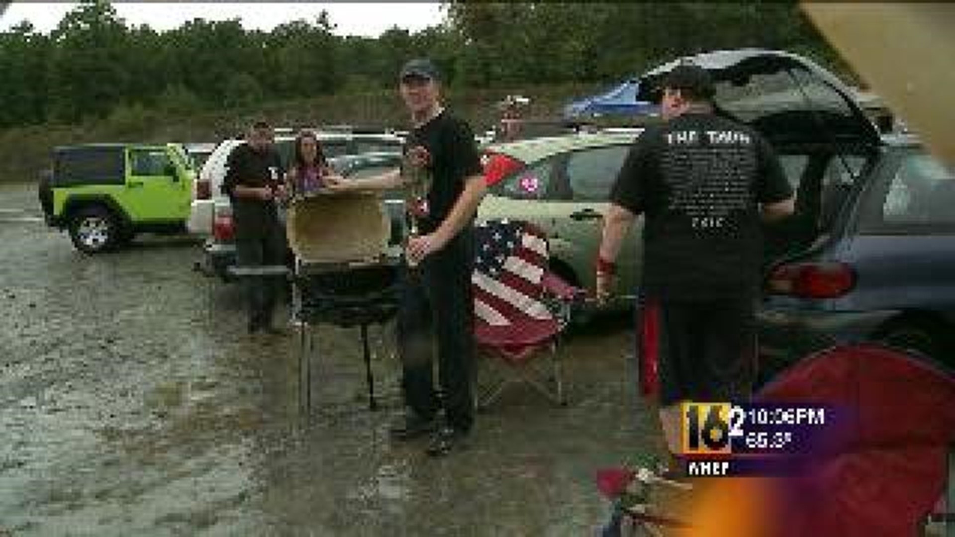 KISS, Mötley Crüe Fans Deal With Wet Weather