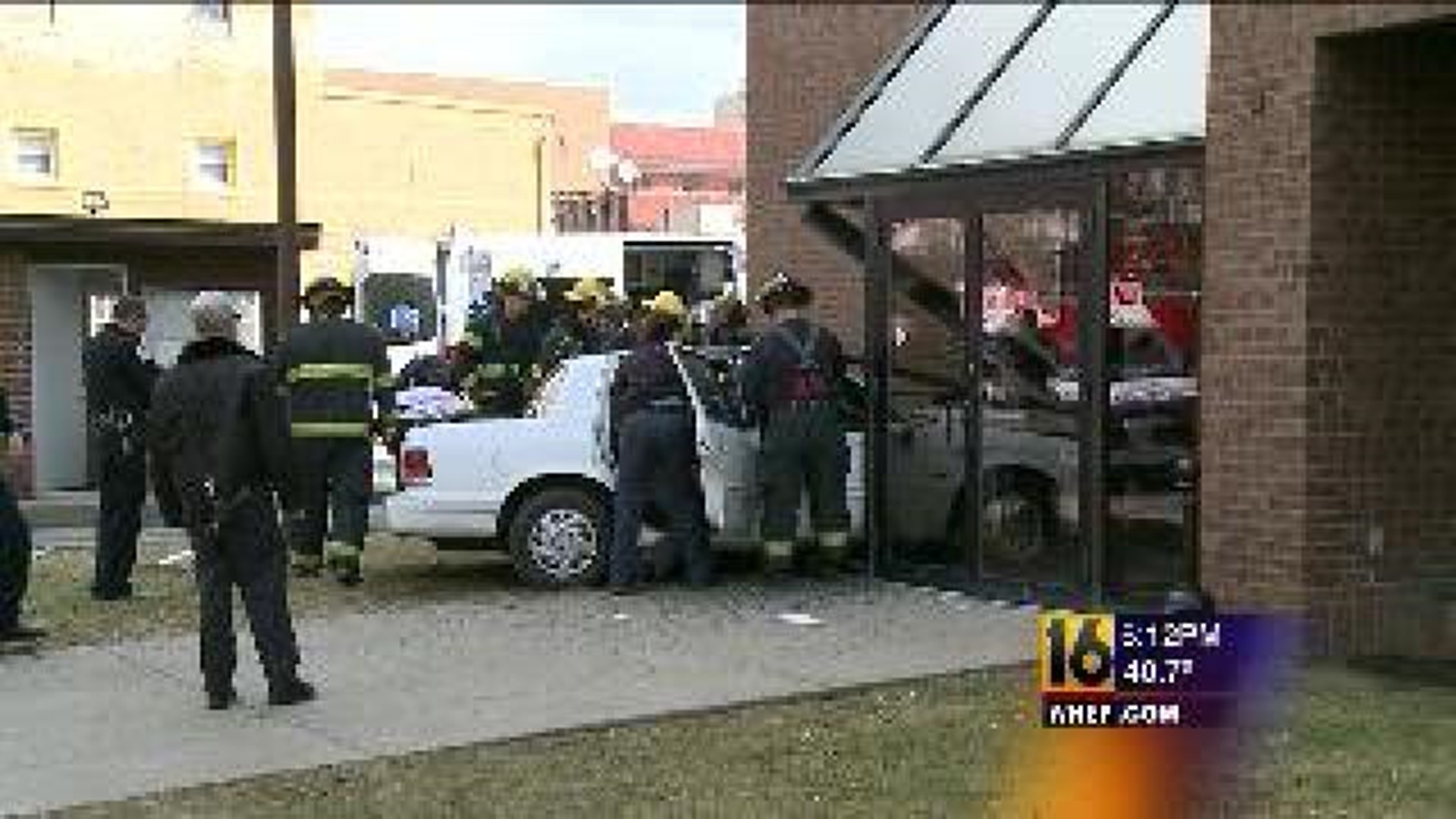 Two Hurt When Car Hits Downtown Building