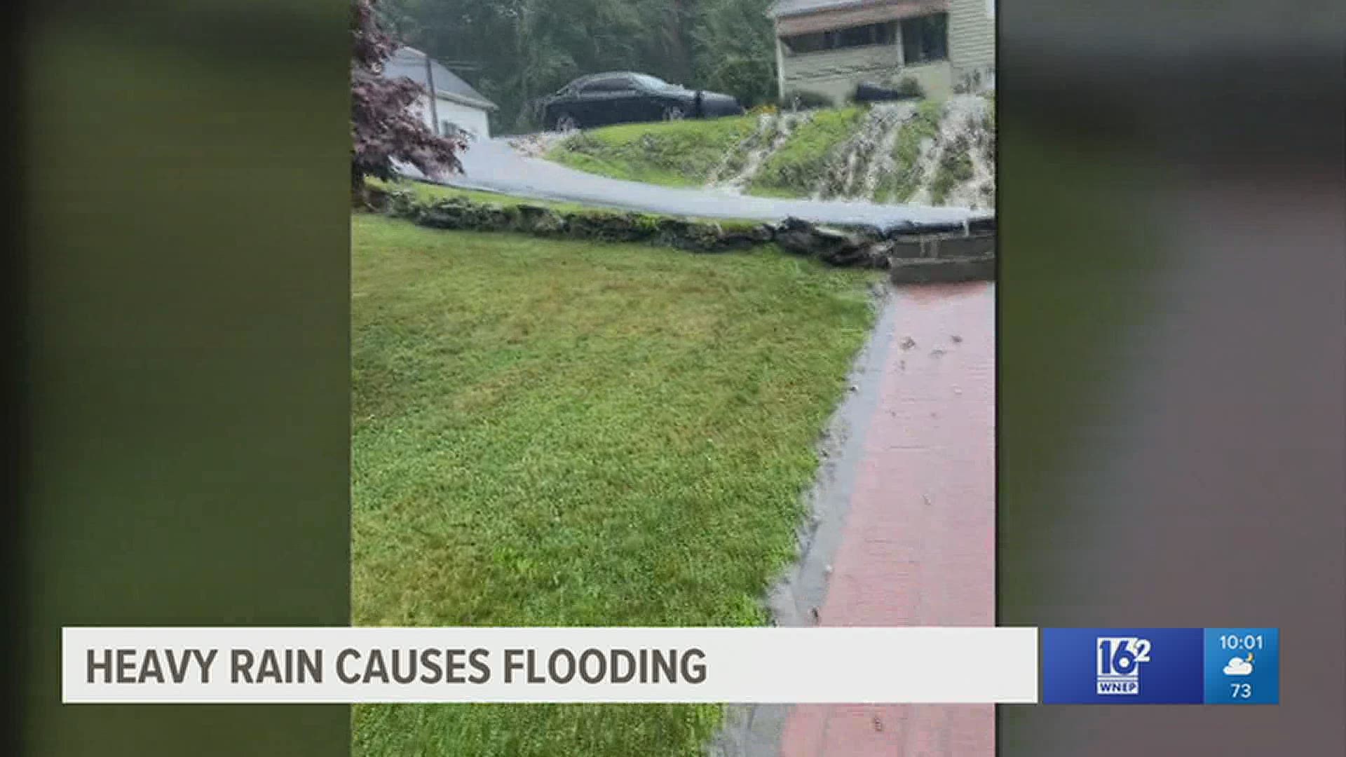 Flash flooding shut down roads in the Electric City and caused damage to some homes Friday.