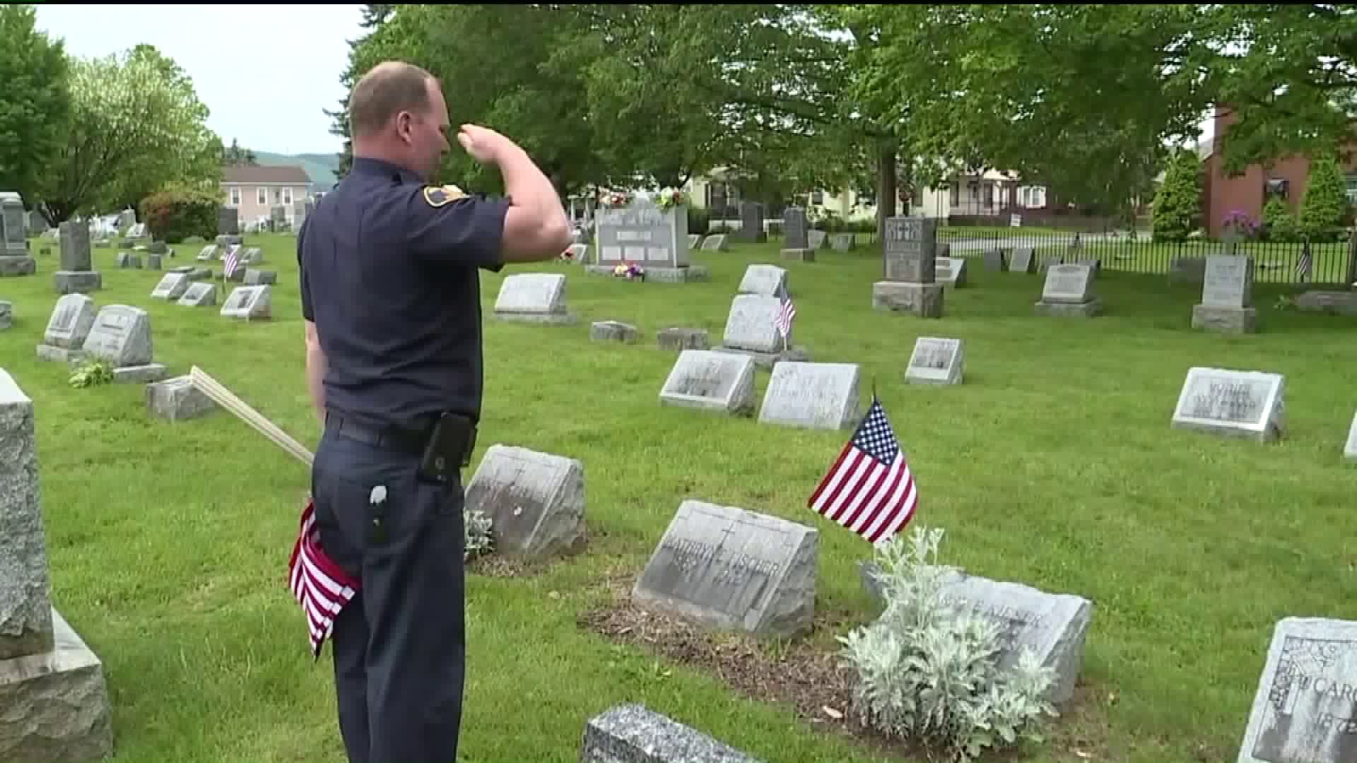 Flags Placed on Veterans' Graves by Williamsport Firefighters