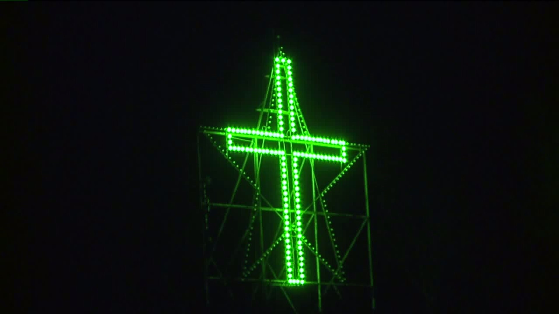 Simpson Cross Glows Green for Veteran`s Day