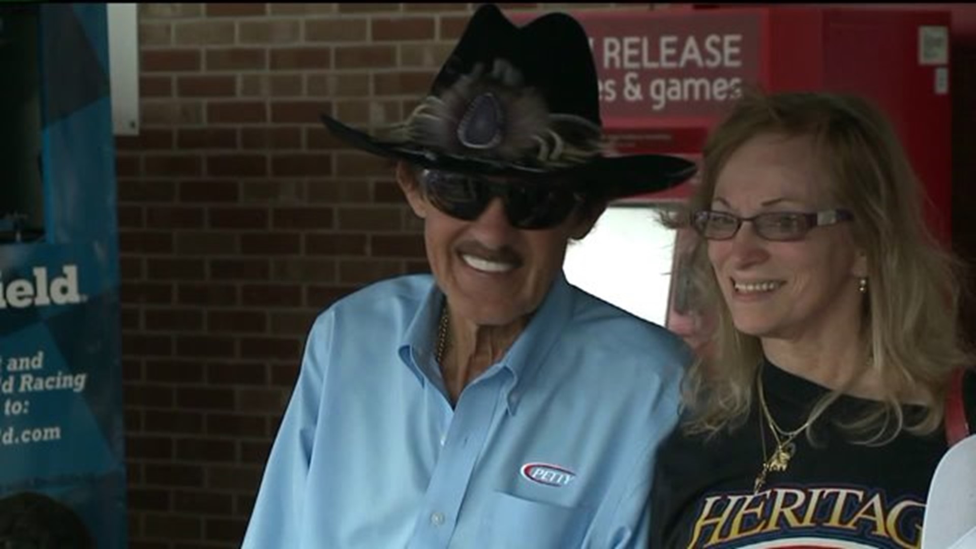 Racing Legend Brings Big Donation to Food Bank