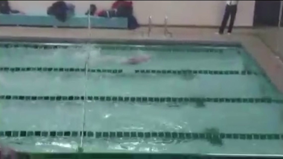 Swim Team Cheers for Opposing Swimmer During Meet