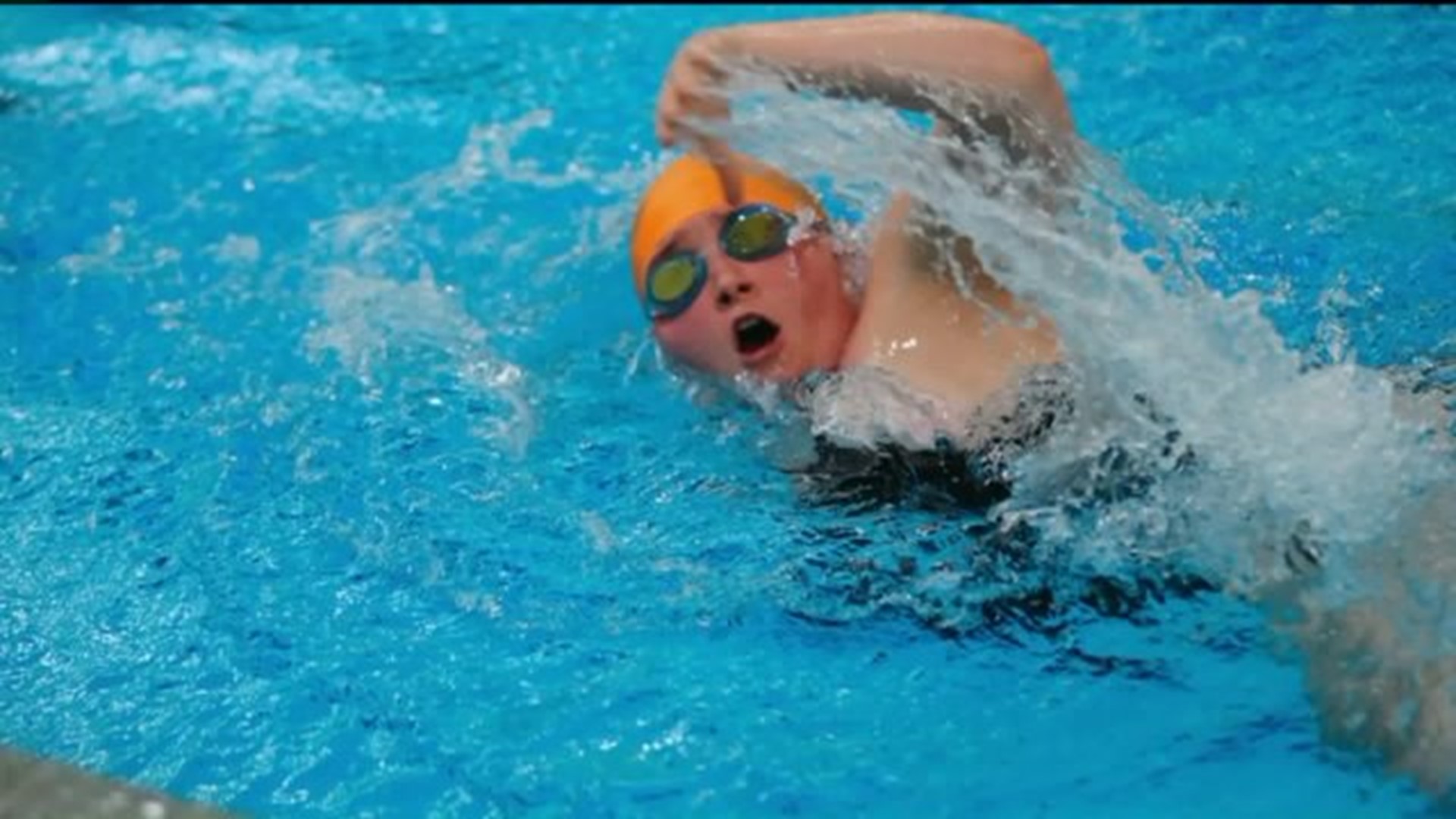 Swim Team Cheers for Opposing Swimmer During Meet