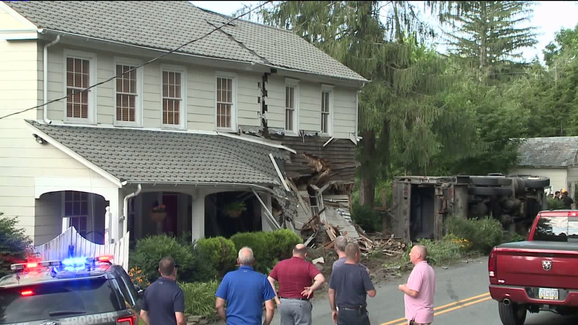One Dead After Garbage Truck Slams into Home