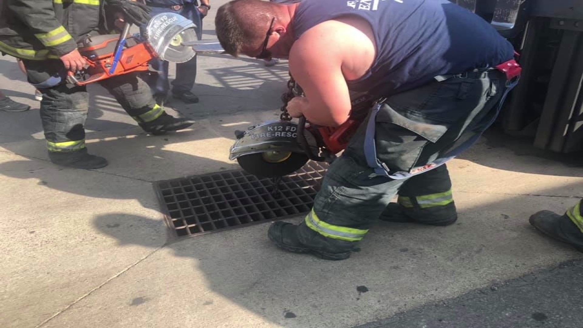 The fire department used industrial saws to cut a sewer grate and free the man.