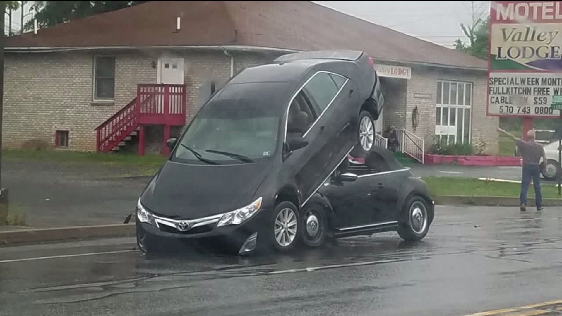 Car Ends up on Top of Another Car
