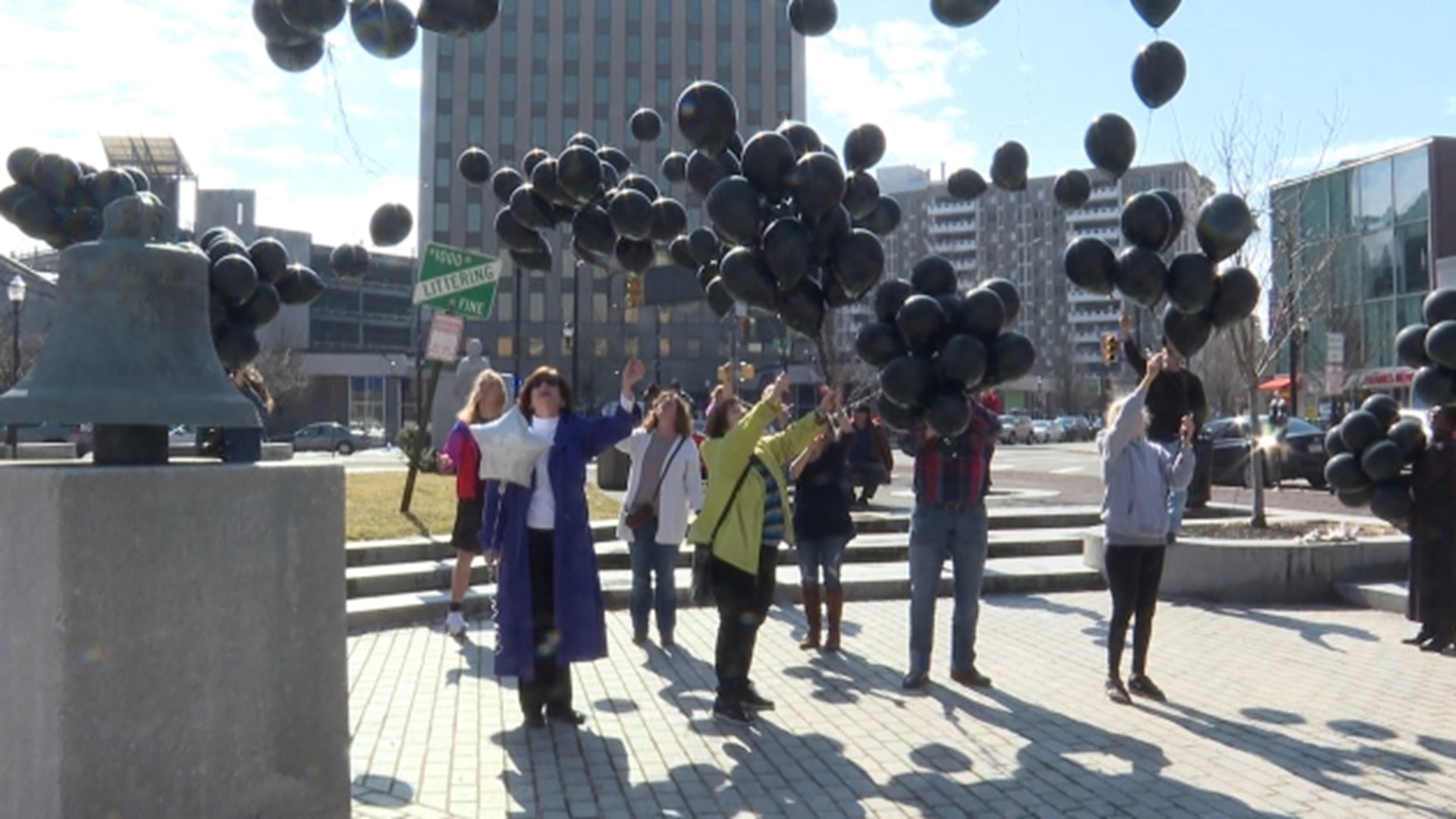 A small group released a large number of black balloons in Public Square on Sunday, each balloon representing a life lost to an overdose in the area this past year.