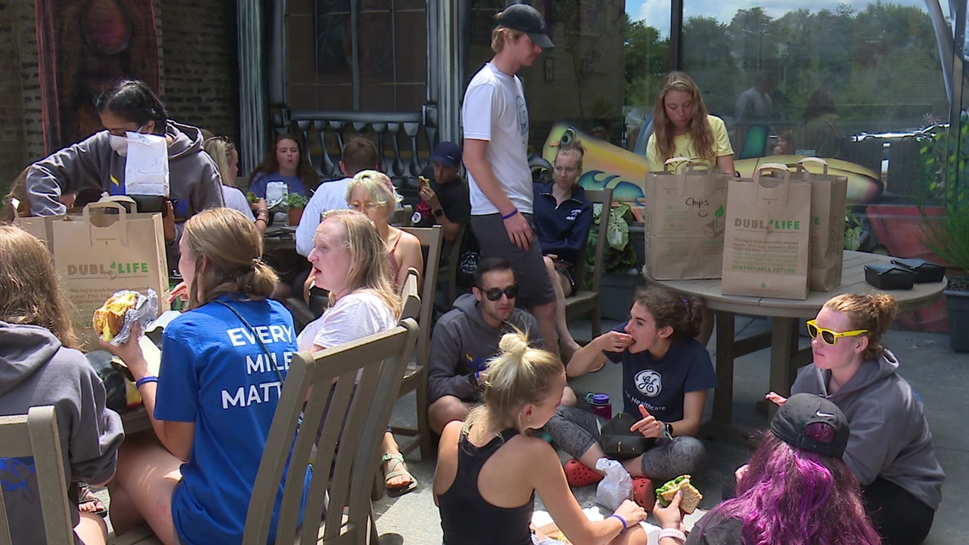 They're making the 4,500-mile trek to raise money for young adults with cancer. Business owners pitched in to provide the group with food and a place to sleep.