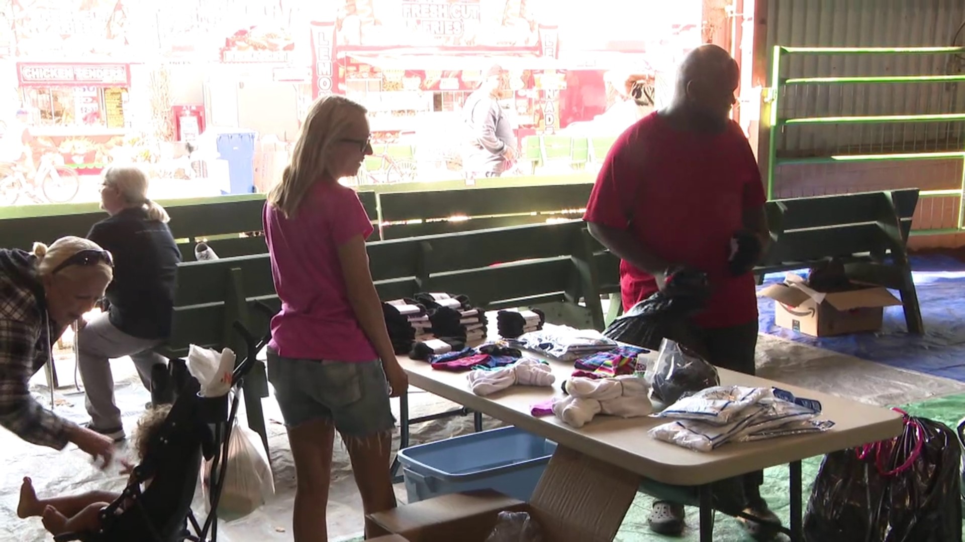 Volunteer groups give amusement workers new clothes and much more at one of the areas largest fairs