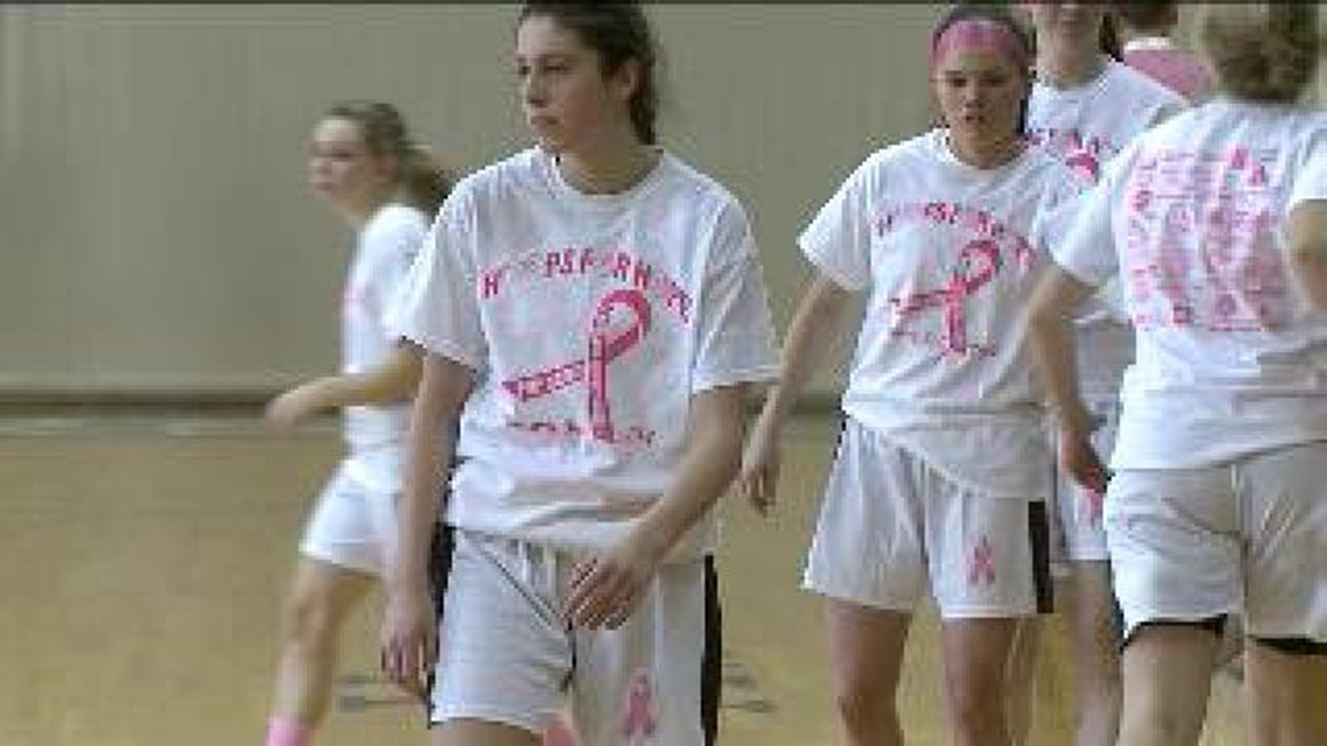 Teams Face Off in ‘Pink Night’ Basketball Game