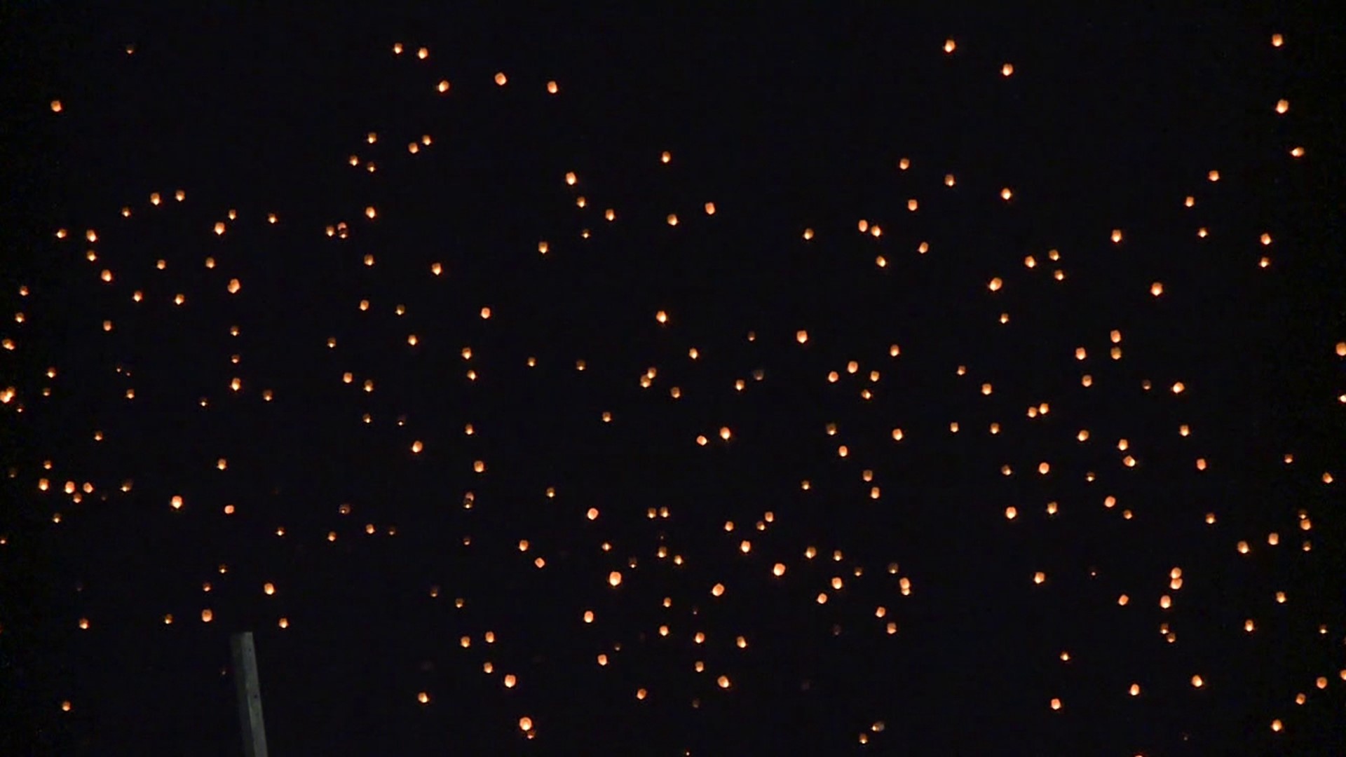 Folks gathered at the raceway to release thousands of lanterns into the sky after sunset Sunday evening.