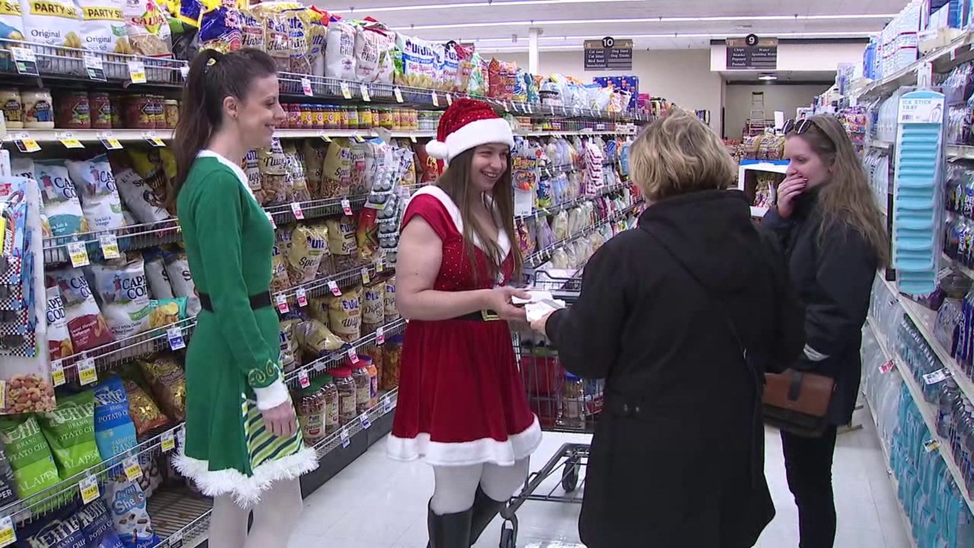 A holiday surprise in Monroe County Tuesday as customers at a grocery store received gift cards to help pay for their groceries, thanks to a couple of elves.