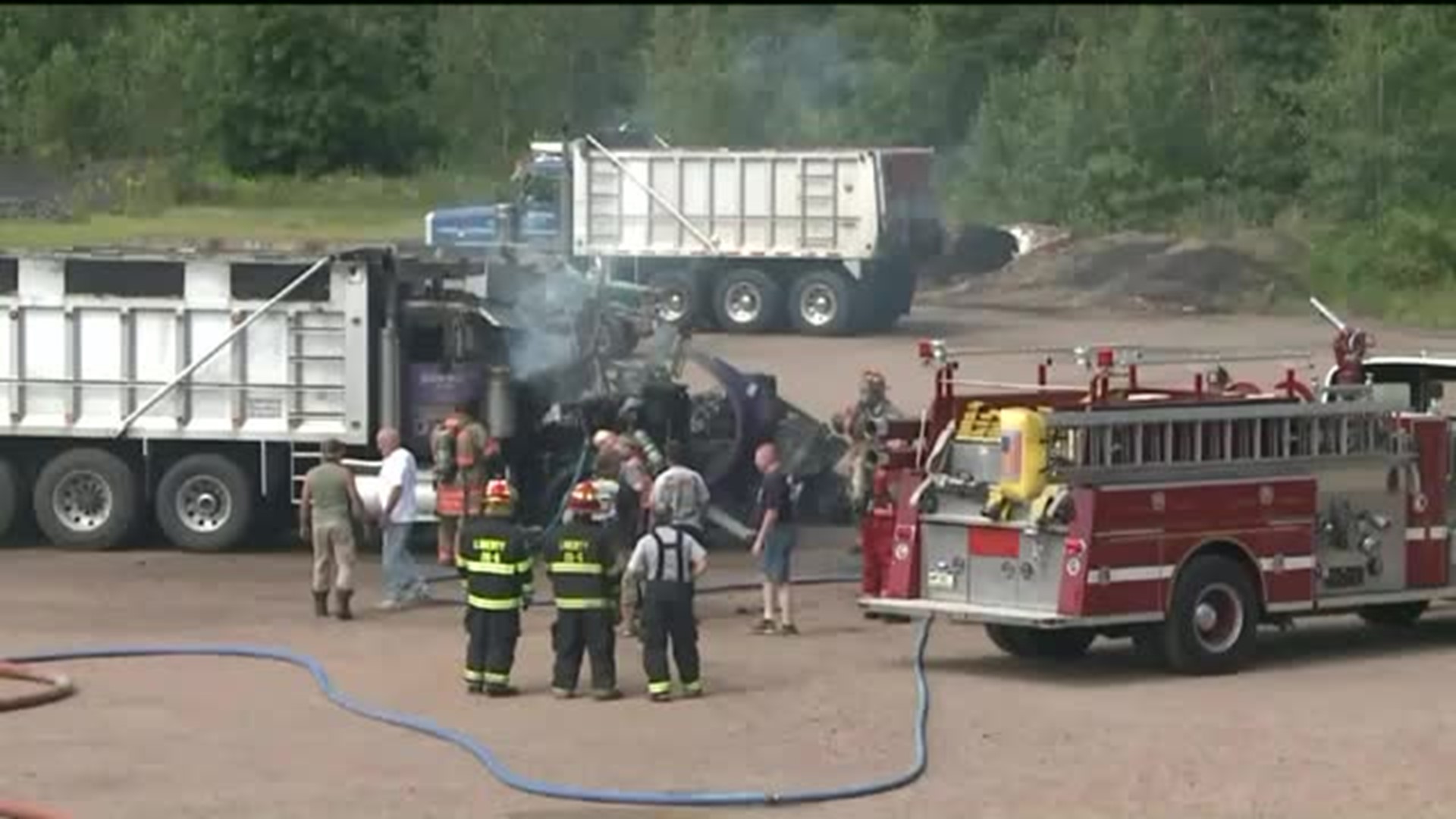 Flames Destroy Two Dump Trucks