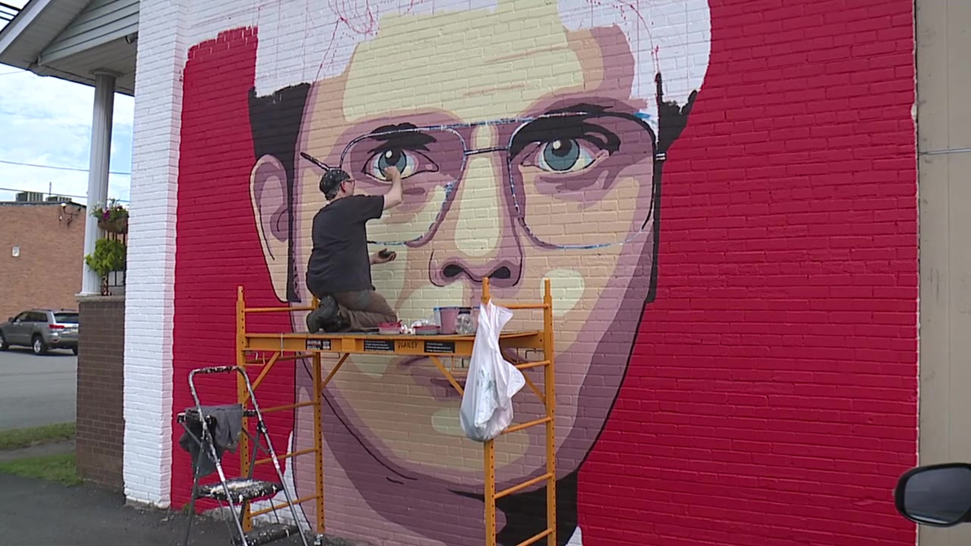 Dwight Schrute returns to Scranton in the form of a new mural being painted on a shop wall.