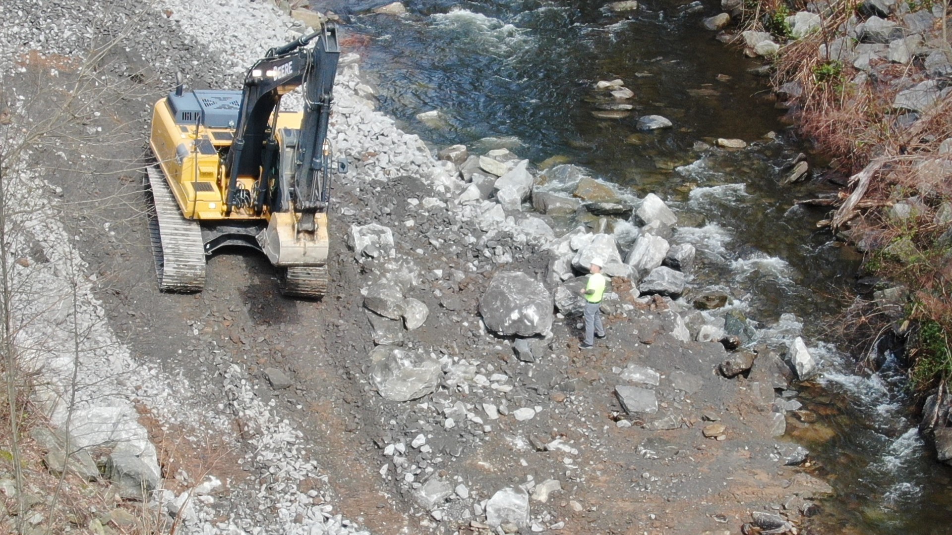 The subsidence opened in Toby Creek behind Luzerne Lumber near Main Street in Luzerne on Sunday.