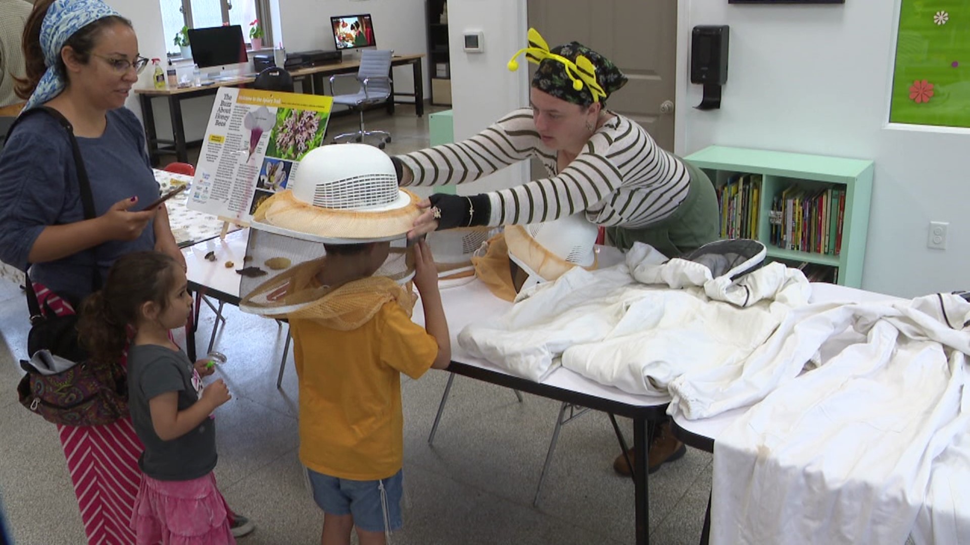 Attendees got the chance to see real bees in a hive, try on a beekeeping suit, and taste some honey.