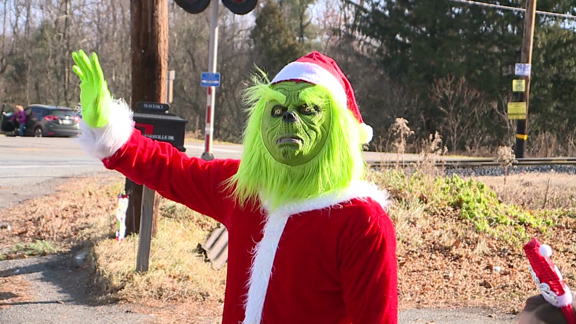 A notoriously grumpy green Santa impersonator is on the loose again, this time in Schuylkill County, but this year, he's giving instead of stealing.