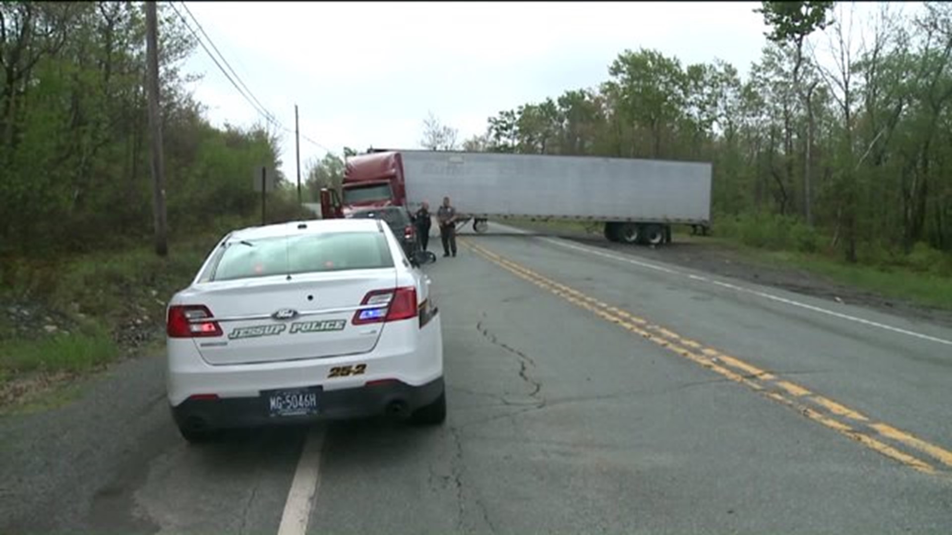 Stuck Truck Blocks Road