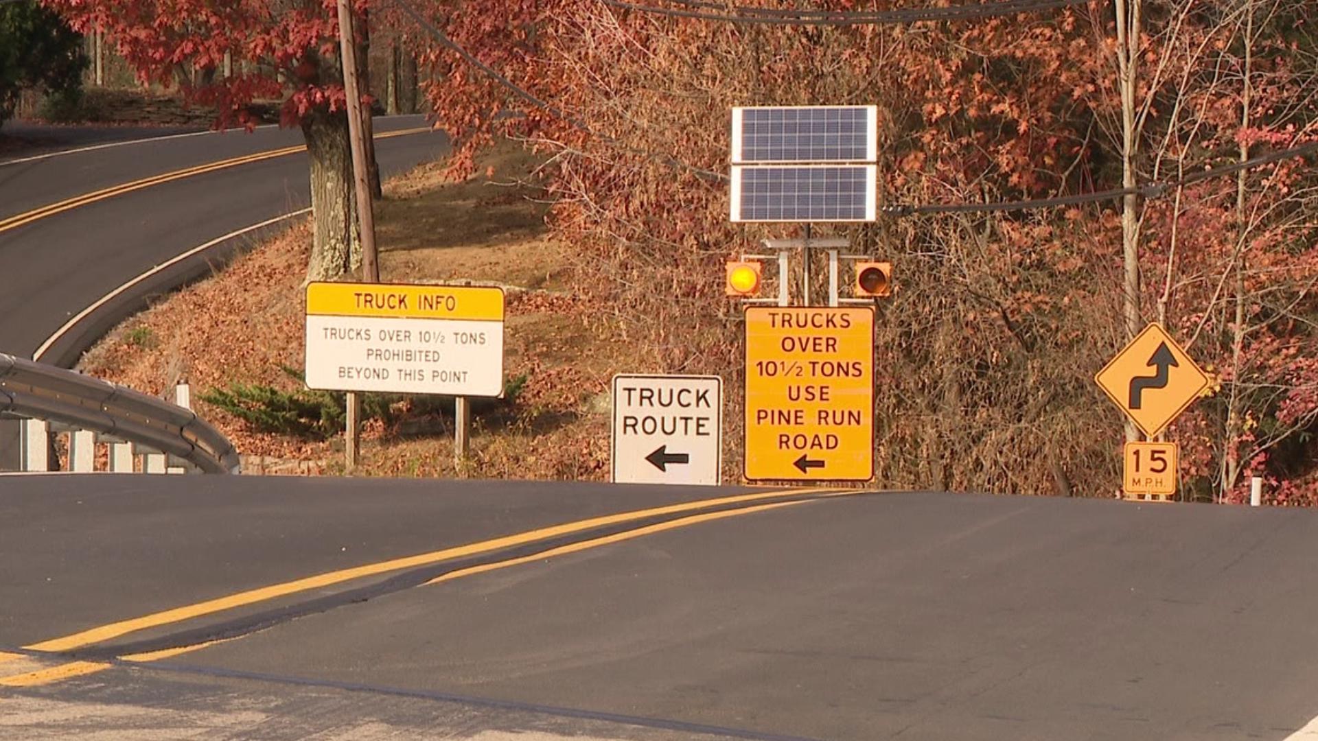 Signage, lights, and chimes are being added to Laurel Run Road in an effort to keep trucks away from the section known as Giants Despair.