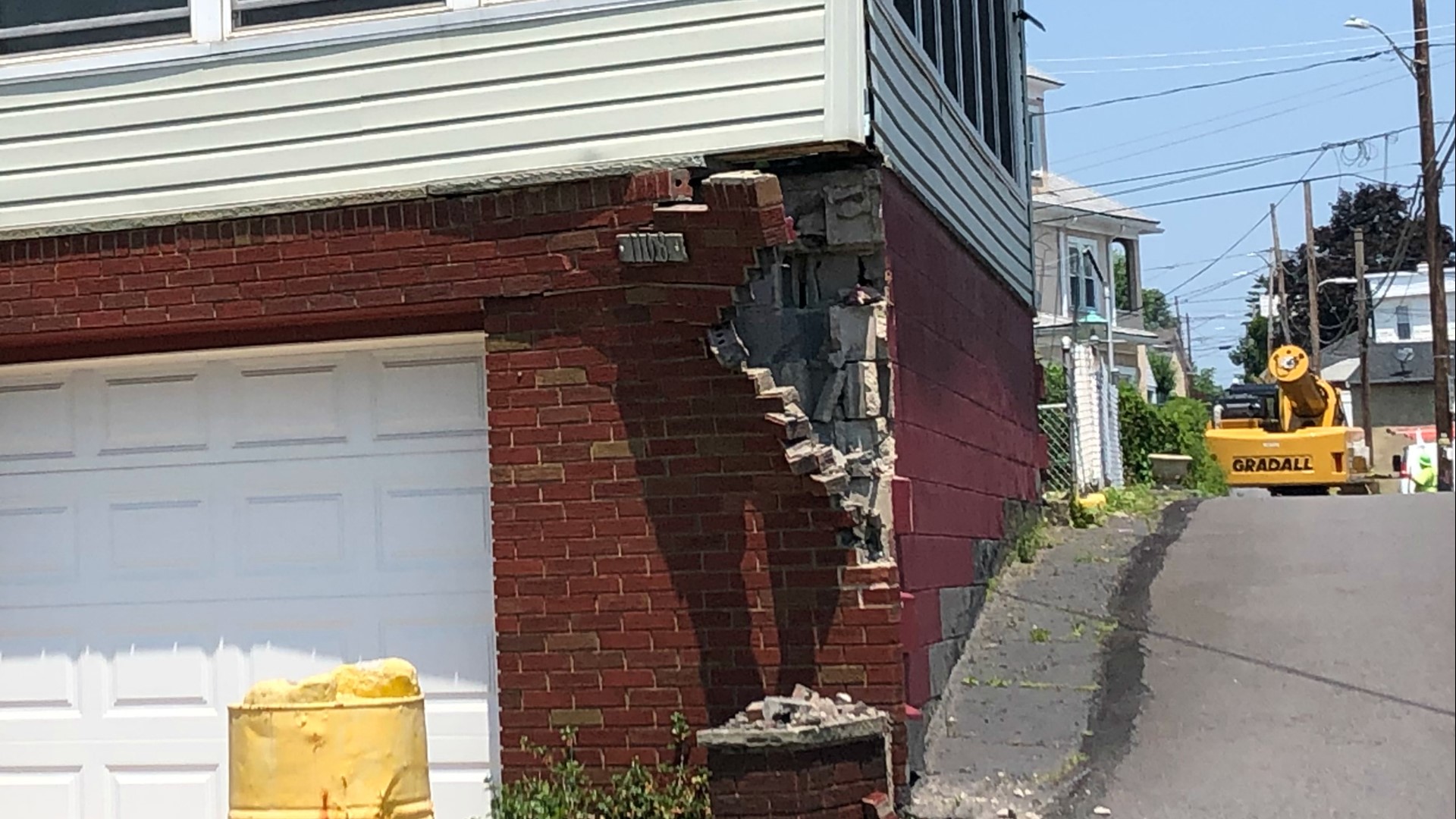 The wreck damaged the brick facade of the structure.