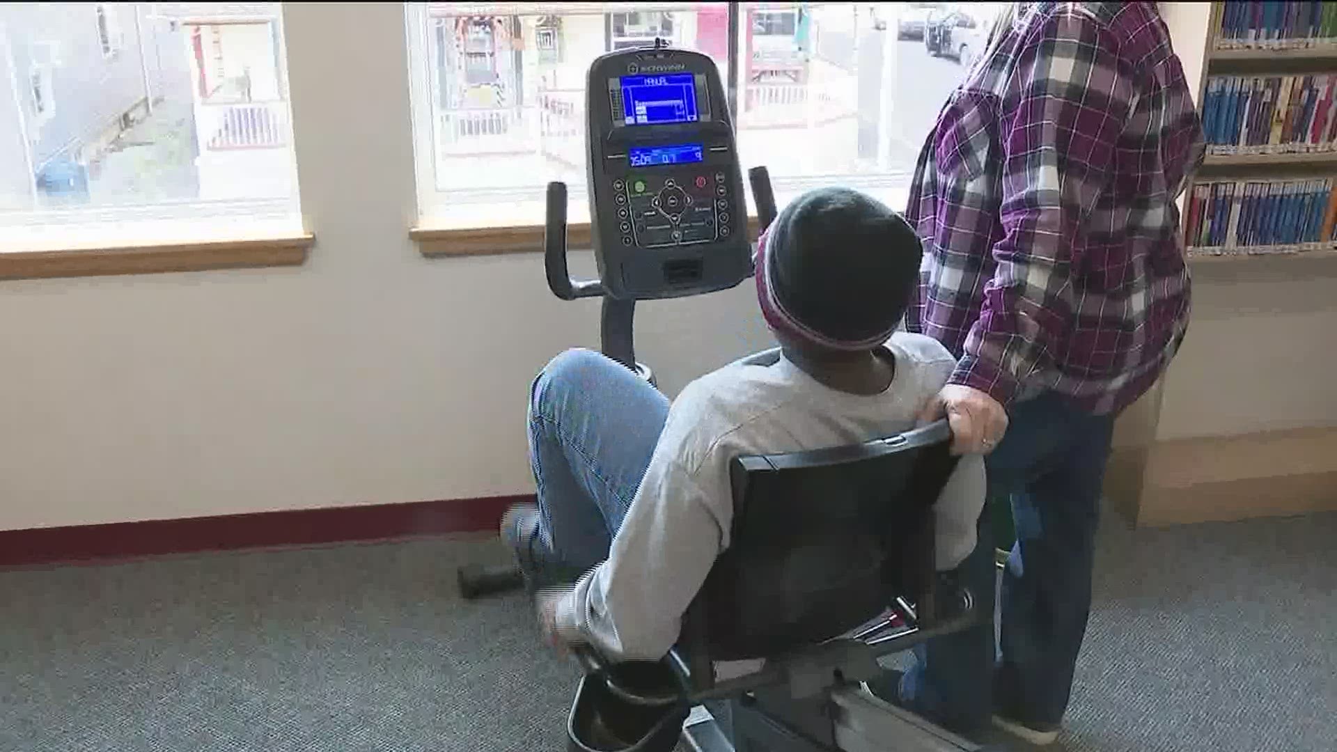 A library in central Pennsylvania is helping people pay off their overdue fines while encouraging fitness at the same time.