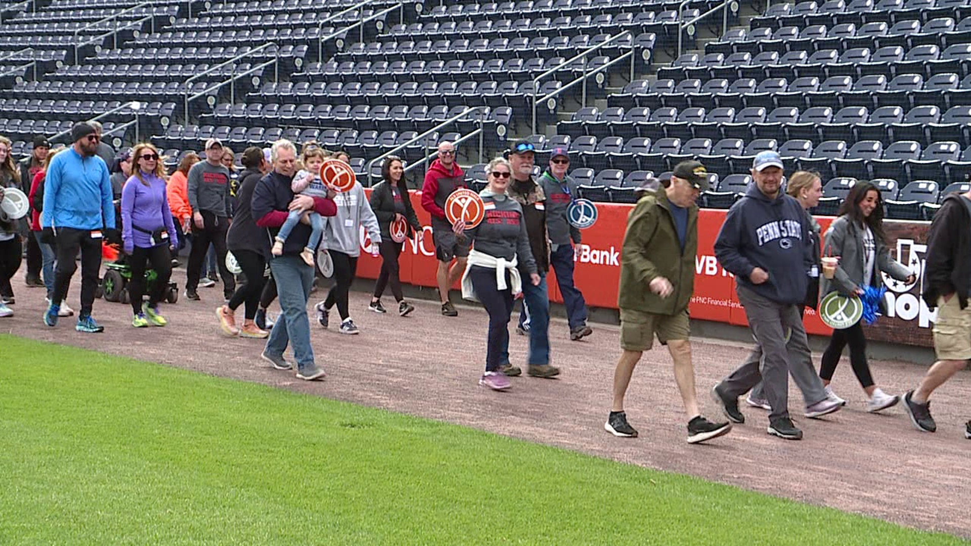 More than 100 people took part in the walk at PNC Field in Moosic to raise money for ALS United Mid-Atlantic.