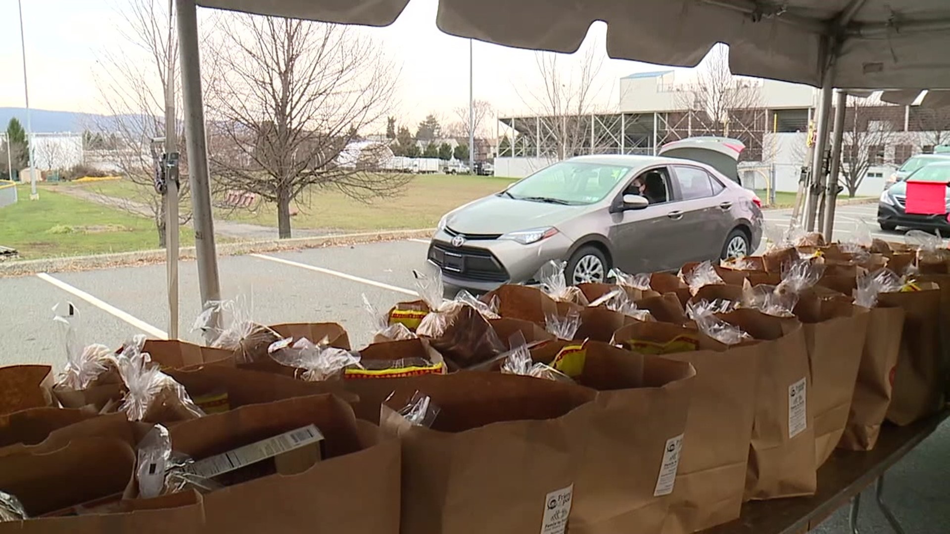 A Thanksgiving tradition moves outside, thousands receive food at Scranton High School