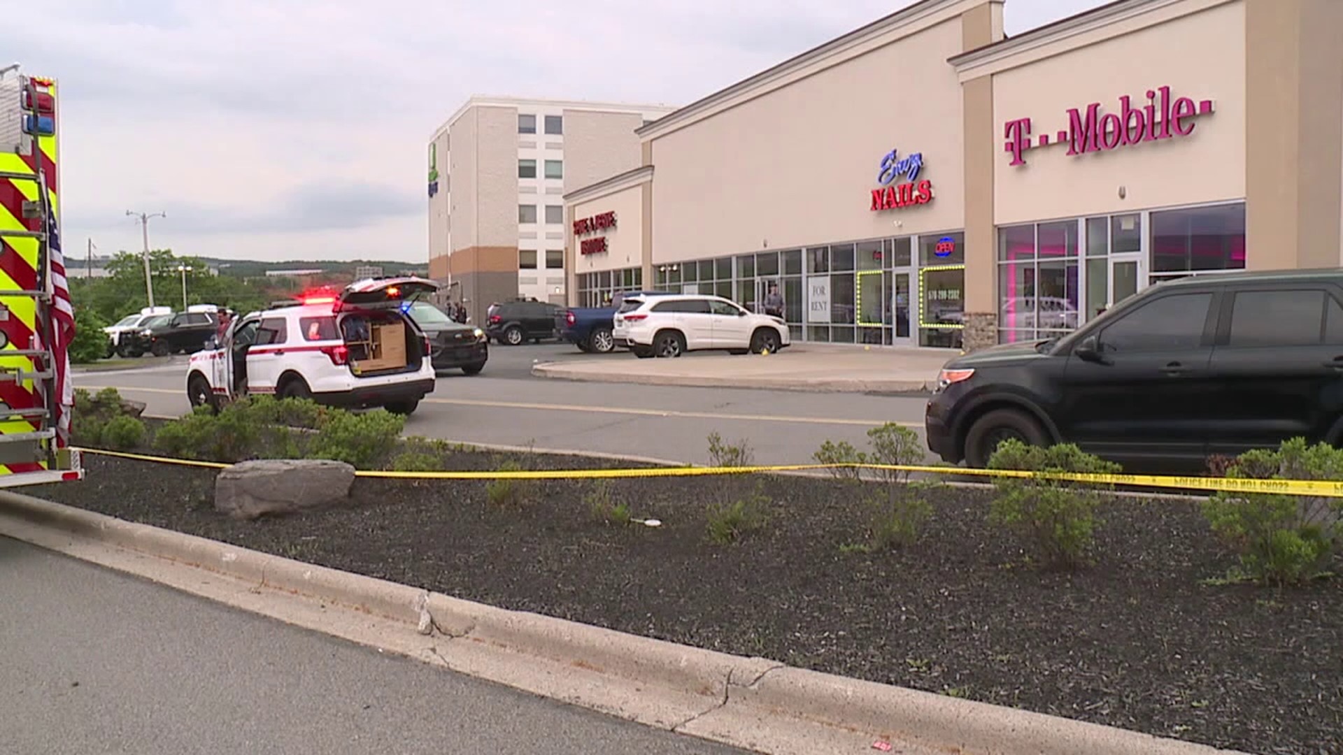 A woman was injured in an early-June shooting at a shopping complex. We're learning the man charged with attempted homicide wasn't the only one who fired shots.
