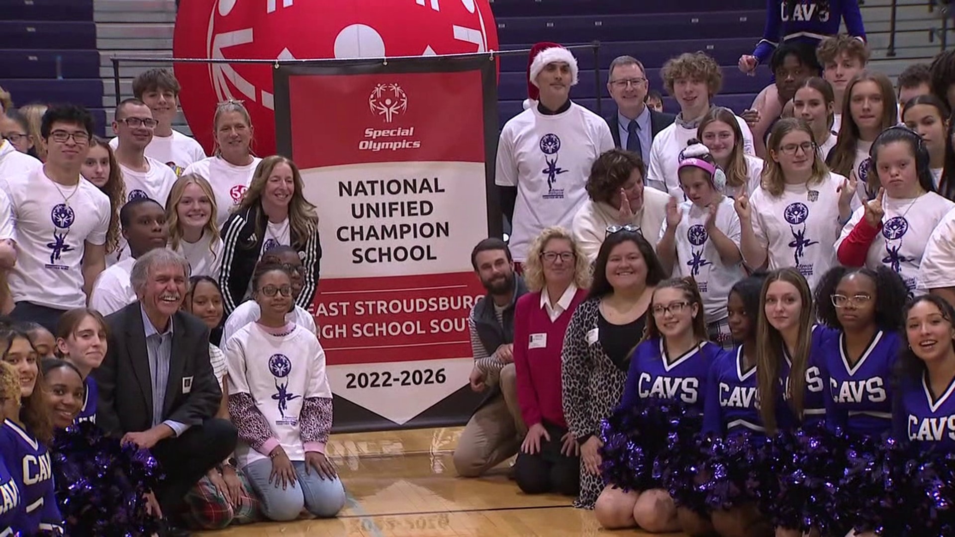 A new banner hangs in the gym at a high school in Monroe County.