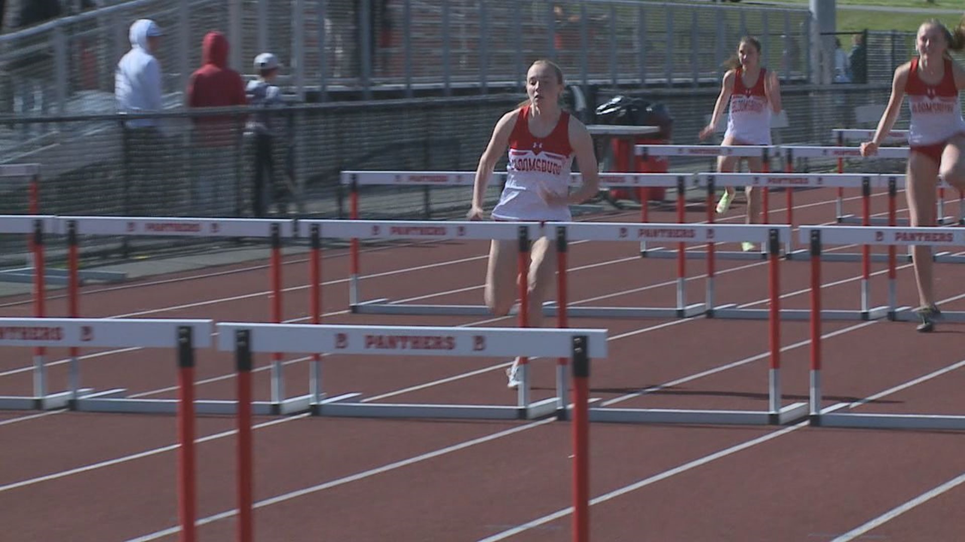 CHARLY SCHLAUCH (SCHLOUCK) FROM BLOOMSBURG
WINS THE GIRL'S 100 HURDLES...THE WINNING TIME 15.41 SECONDS