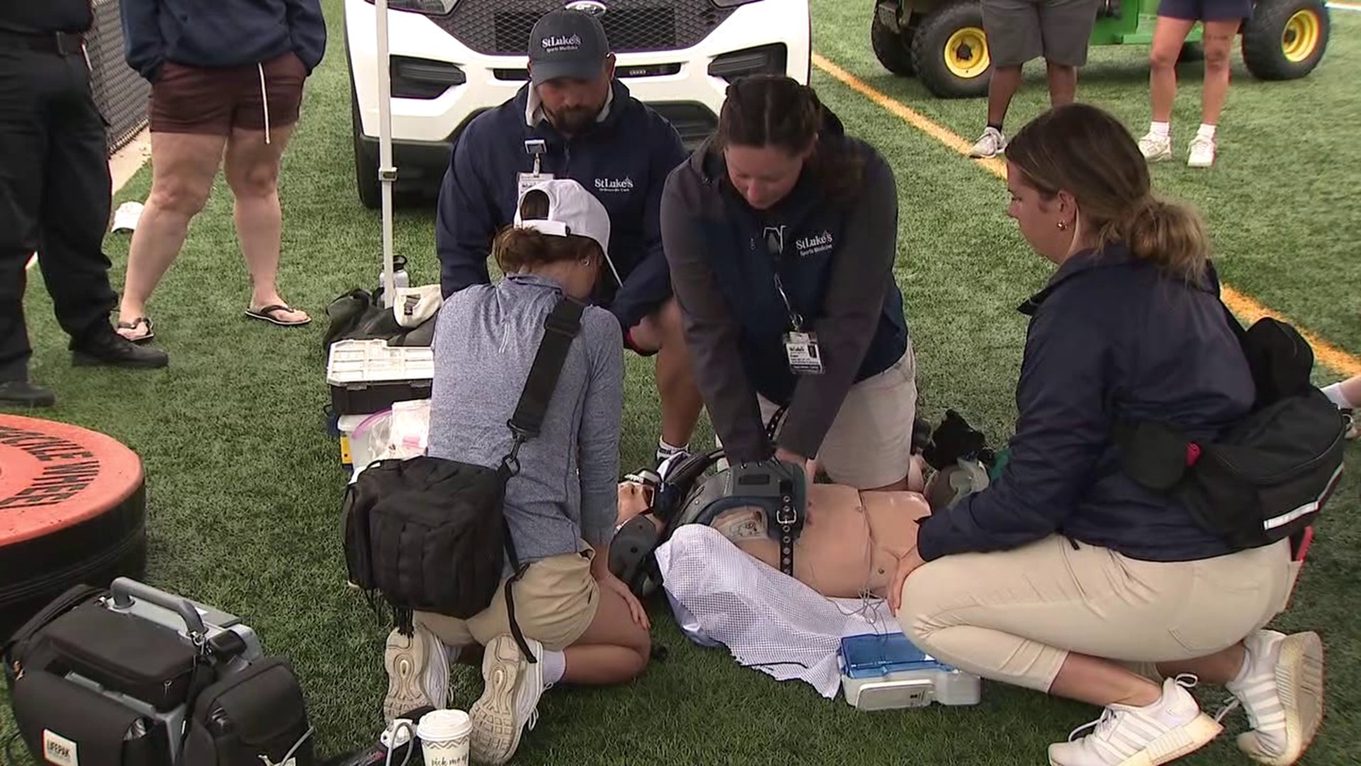 In a series of training exercises designed to simulate the response to a cardiac arrest event during a practice or a game, athletic trainers fine tuned their skills.