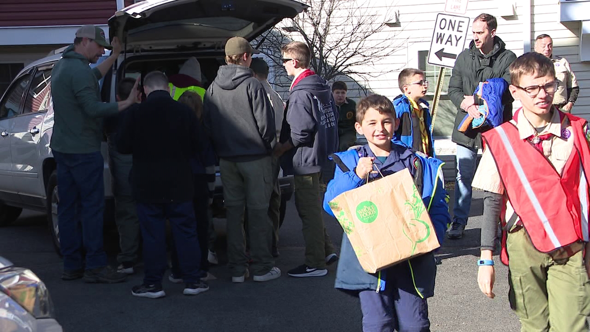 Dozens of Boy Scouts came together Saturday to help those in need ahead of the holiday.