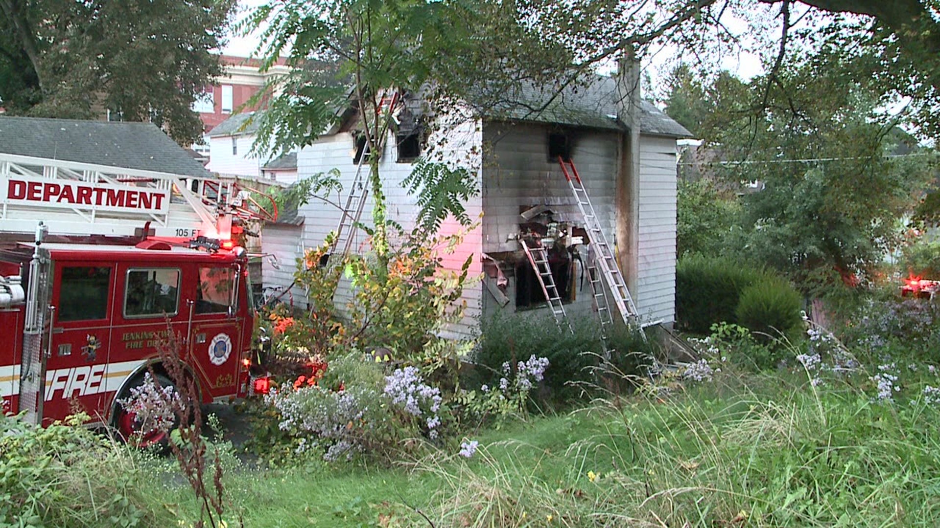 Police took the former occupant of the home into custody because of the suspicious circumstances surrounding the fire.