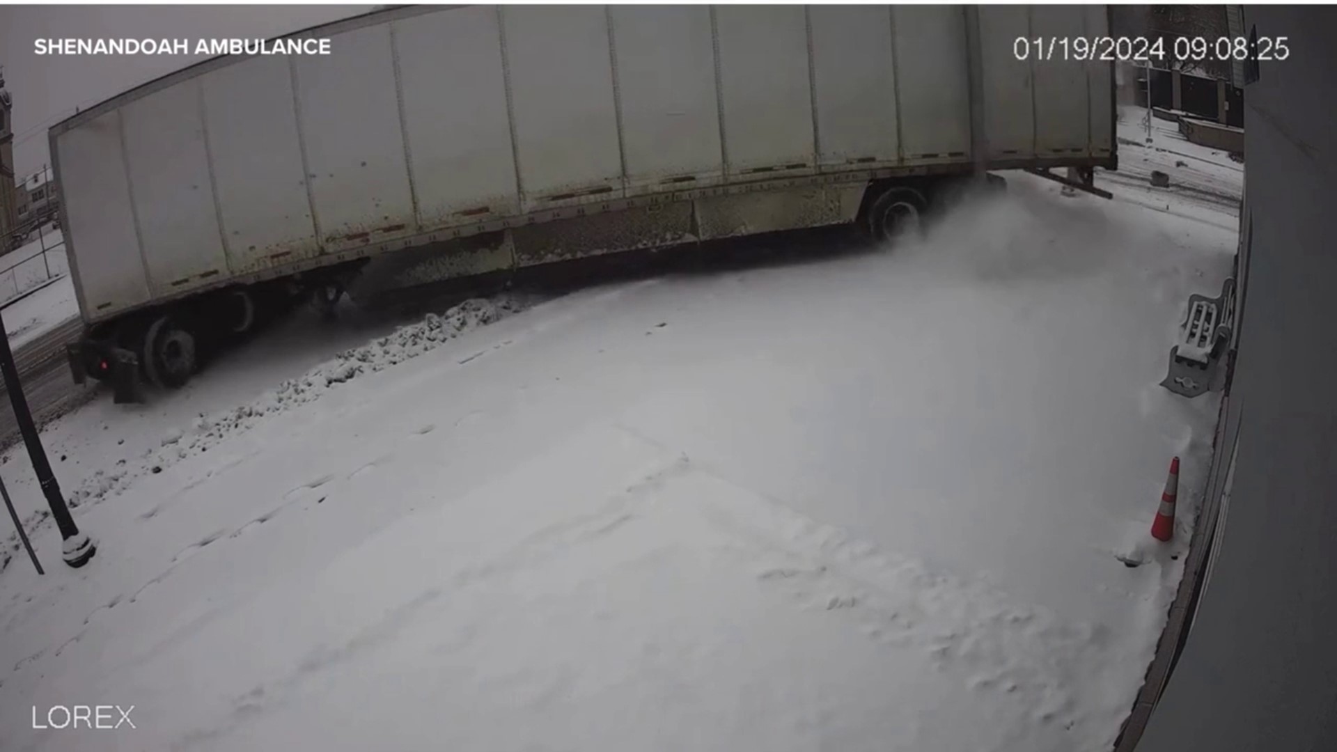 Security video from Shenandoah Community Ambulance shows a jackknifed semi truck nearly crashing into their building during some winter weather on January 19, 2024.