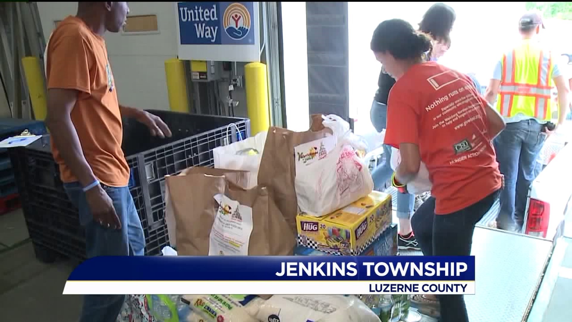 Christmas in July Event Supplies Food for Those in Need