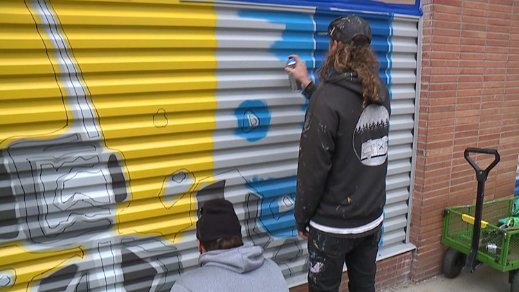 Mural artists sprucing up county building in Scranton
