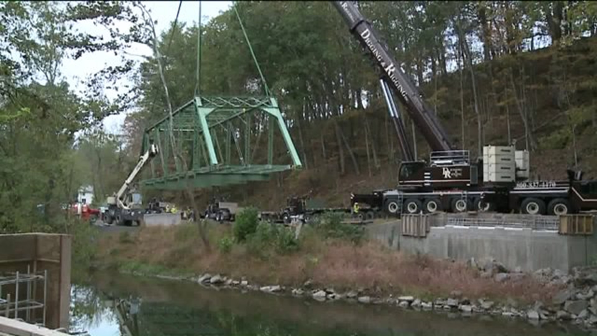 Crews Use Crane to Drop New Bridge in Place